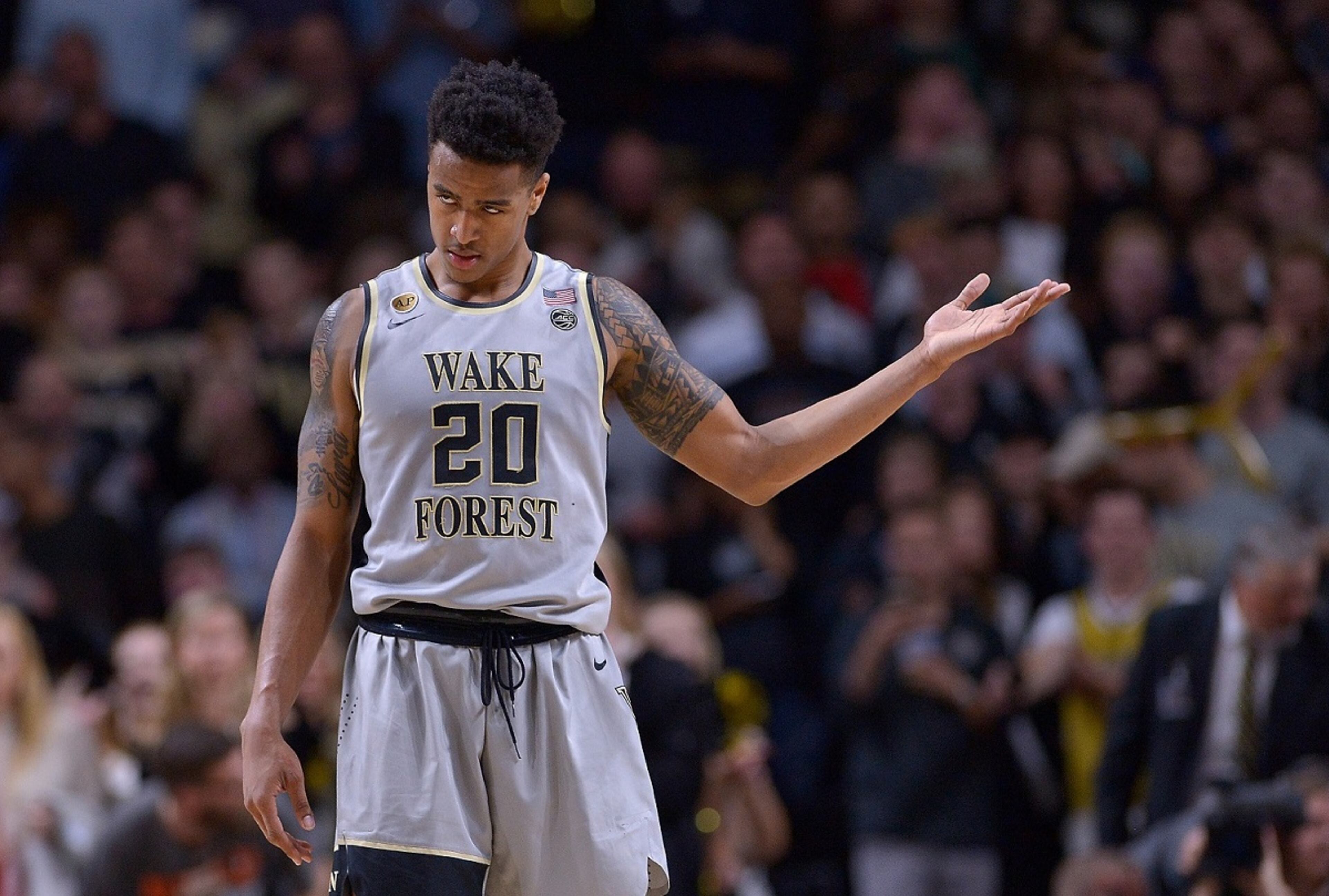 WINSTON-SALEM, NC - MARCH 01: John Collins #20 of the Wake Forest Demon Deacons gestures to the crowd during the final seconds of a win against the Louisville Cardinals at the LJVM Coliseum Complex on March 1, 2017 in Winston-Salem, North Carolina. Wake Forest won 88-81. (Photo by Grant Halverson/Getty Images)
