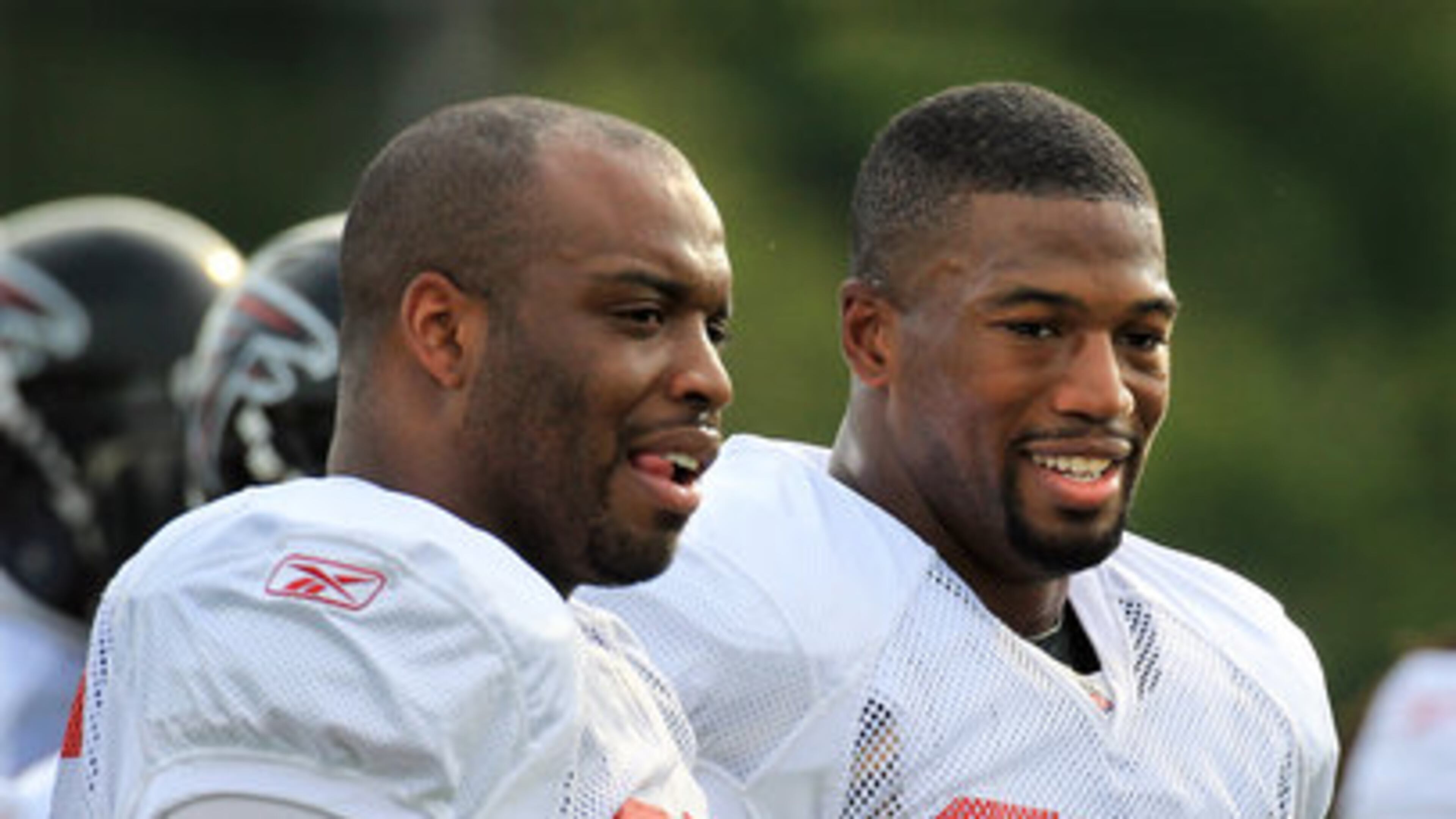 110804 Flowery Branch - Atlanta Falcons defensive ends John Abraham and Ray Edwards watch a play from the sidelines during practice at training camp as Edwards gets some pointers from his new teammate in Flowery Branch on Thursday, August 4, 2011. Curtis Compton ccompton@ajc.com 110804 Flowery Branch - Atlanta Falcons defensive ends John Abraham and Ray Edwards watch a play from the sidelines during practice at training camp as Edwards gets some pointers from his new teammate in Flowery Branch on Thursday, August 4, 2011. Curtis Compton ccompton@ajc.com