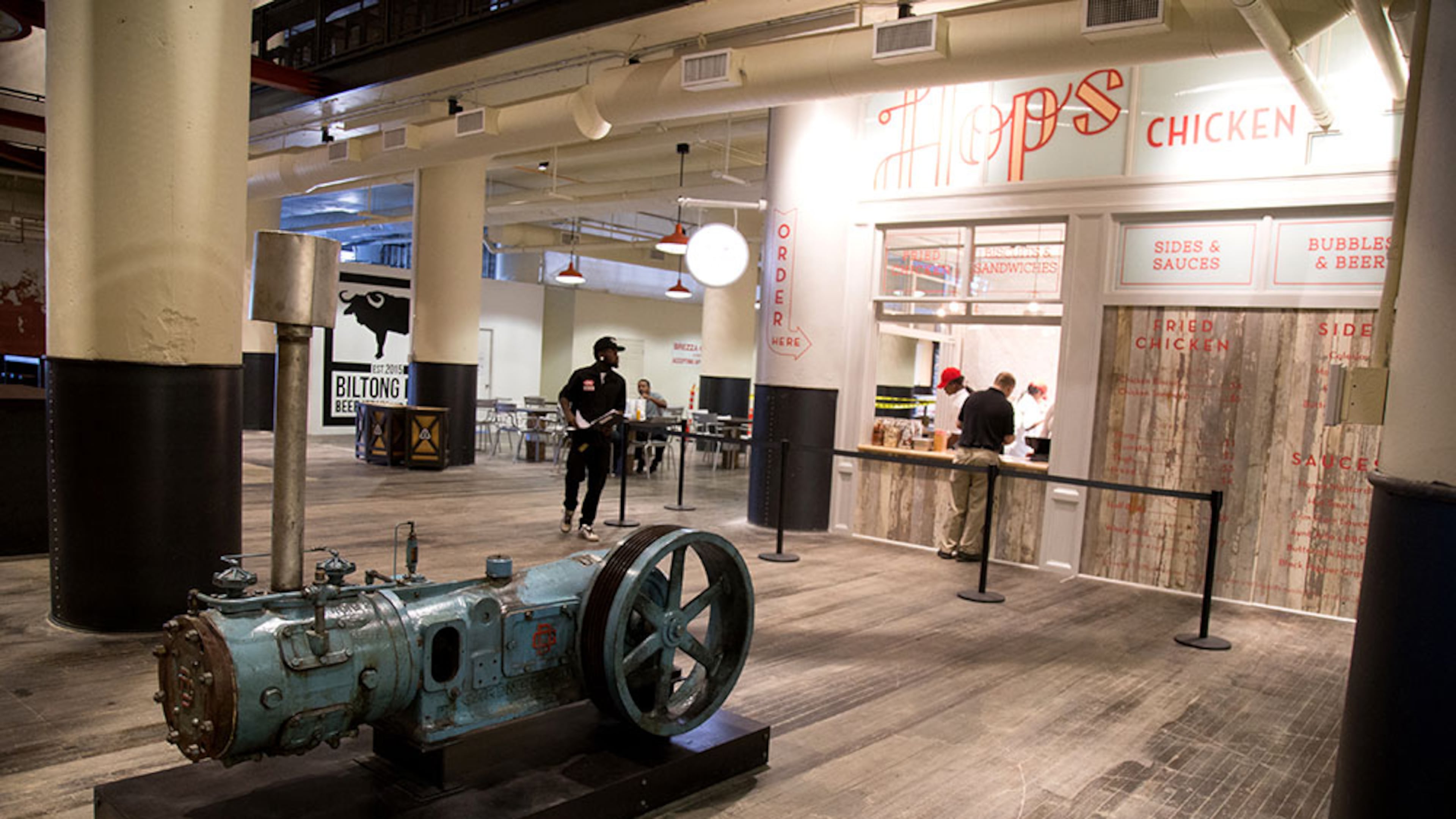 An original air and gas compressor sits in the lobby of Ponce City Market. STEVE SCHAEFER / SPECIAL TO THE AJC