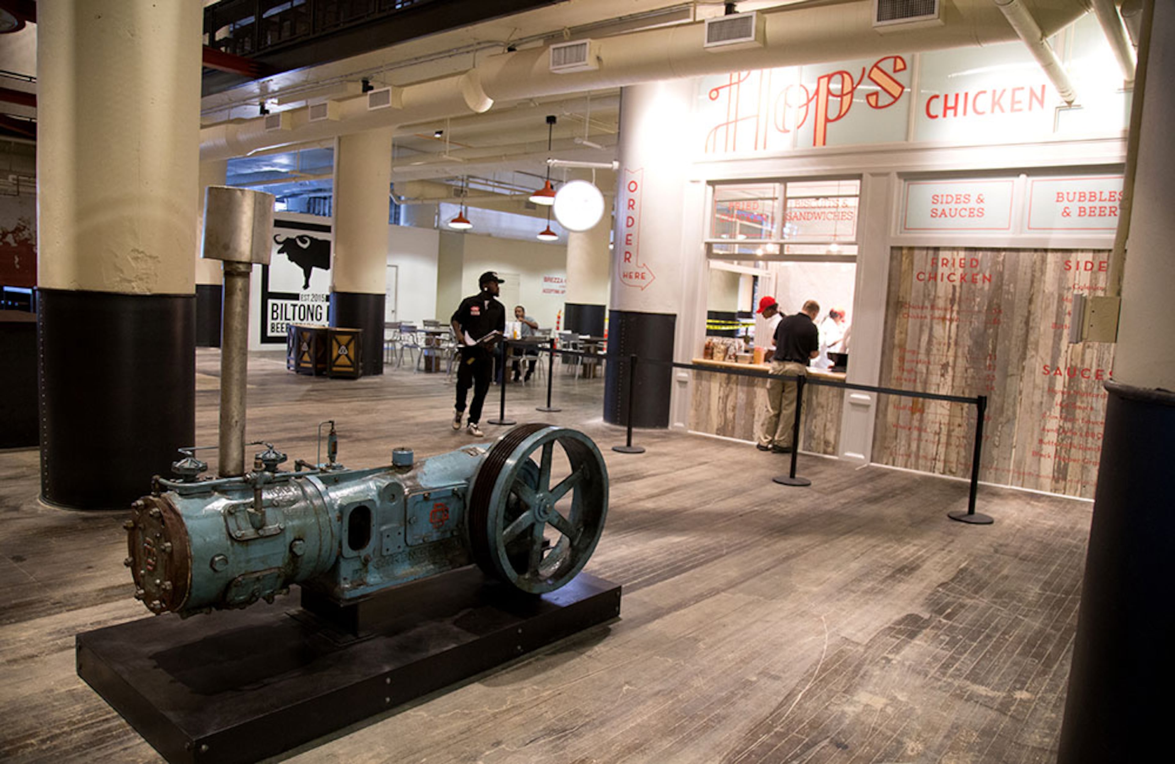 An original air and gas compressor sits in the lobby of Ponce City Market. STEVE SCHAEFER / SPECIAL TO THE AJC