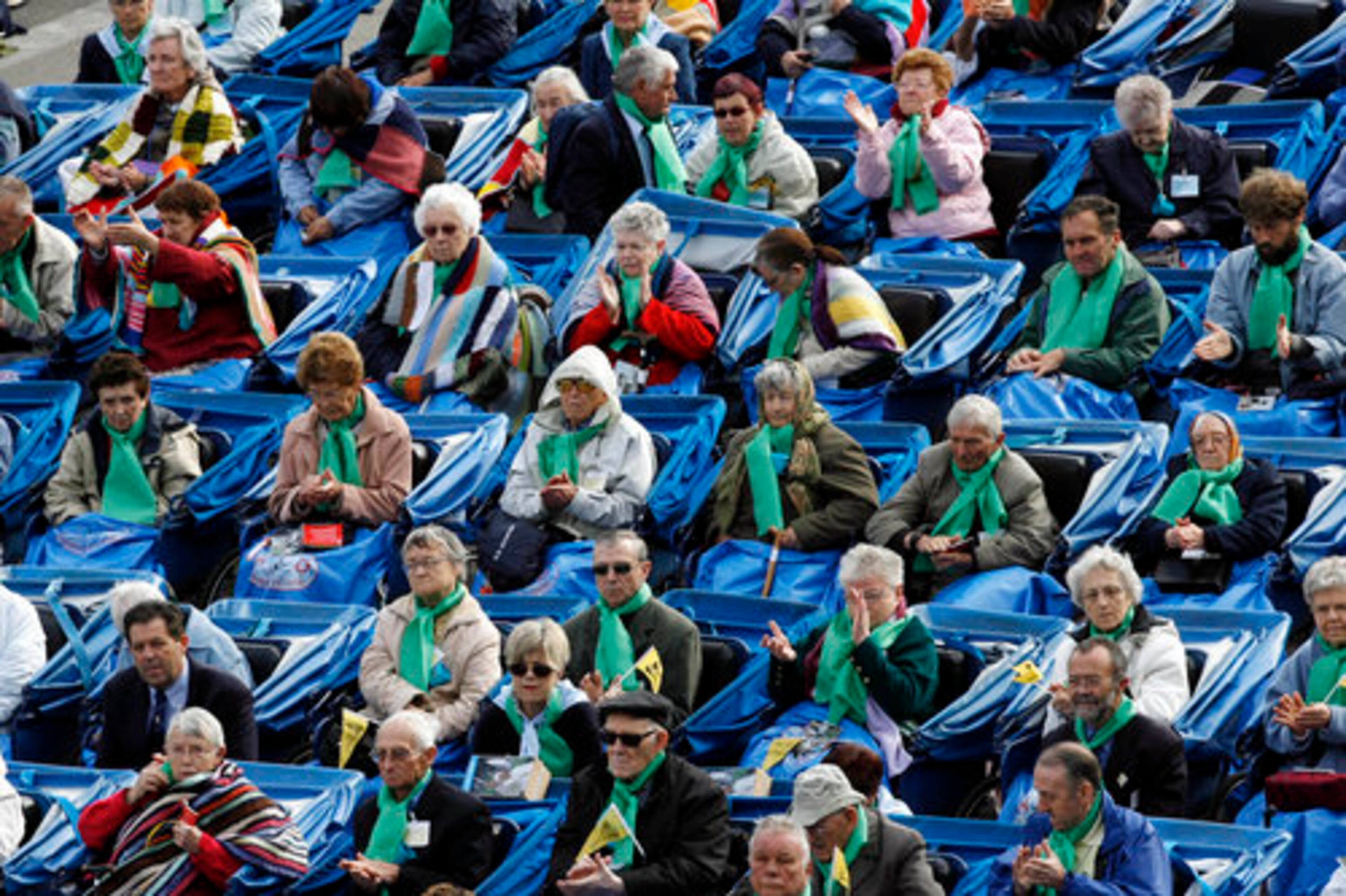 LOURDES PILGRIMS attend a special Mass for the sick. Lourdes, France, hosts 6 million visitors a year, many looking for miracles.