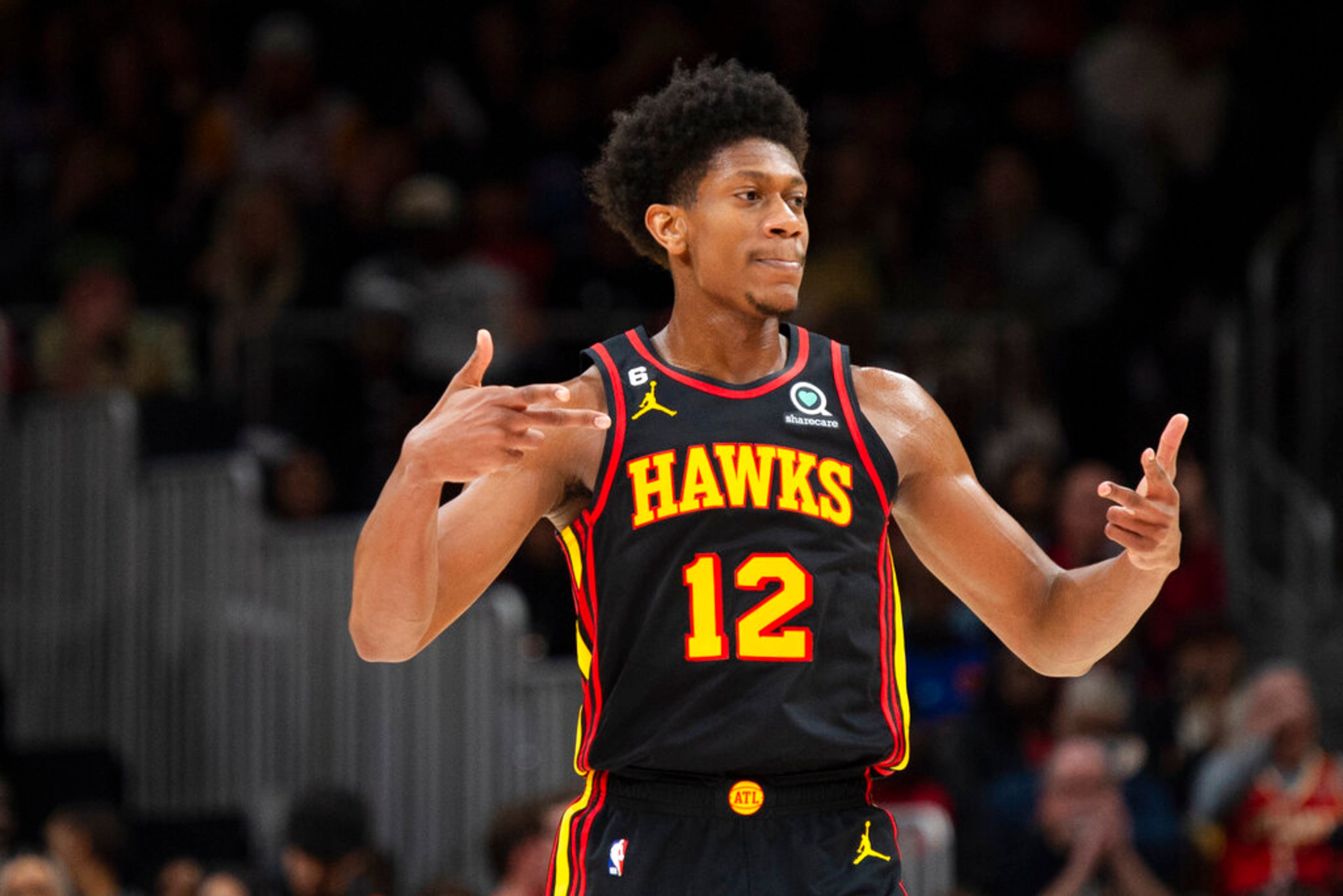 Atlanta Hawks forward De'Andre Hunter reacts after making a 3-pointer during the second half of the team's NBA basketball game against the New York Knicks, Friday, Jan. 20, 2023, in Atlanta. (AP Photo/Hakim Wright Sr.)