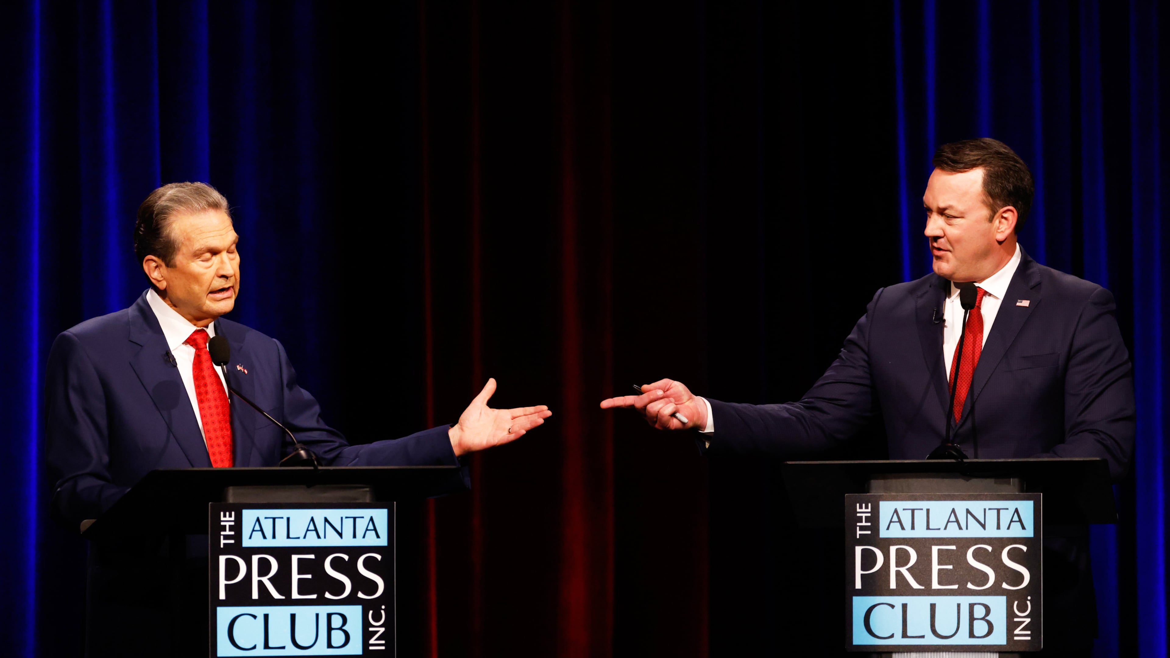 Republican candidates for governor, Rick Jackson, left, and Lt. Gov. Burt Jones interact at the Atlanta Press Club Loudermilk-Young Republican governor primary election debate at Georgia Public Broadcasting, Monday, April 27, 2026, in Atlanta. (Arvin Temkar/Atlanta Journal-Constitution via AP)