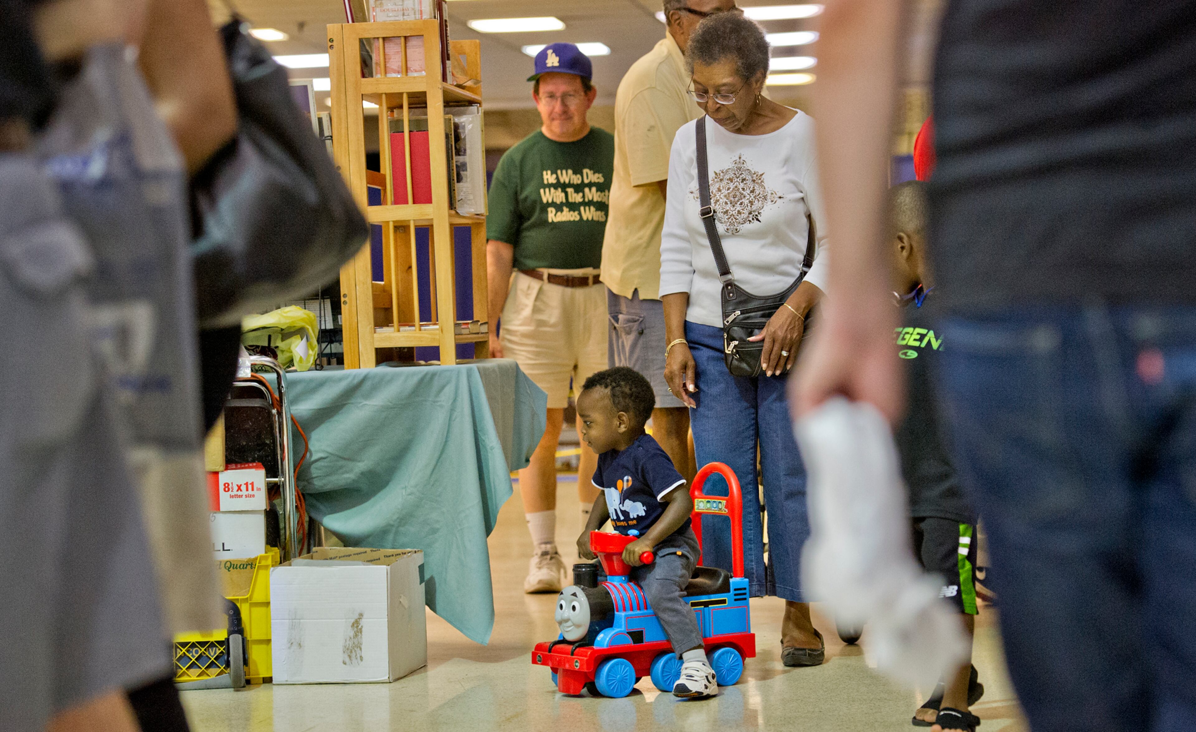 John Callaway III (center) rides a Thomas the Train car followed by his grandmother Lillie Bowles during the 47th Atlanta Model Train and Railroadiana Show and Sale at the North Atlanta Trade Center in Norcross on Saturday, August 9, 2014. The show featured over 300 tables representing dealers from all over the nation showing railroad model items in all gauges as well as railroad antiques. JONATHAN PHILLIPS / SPECIAL