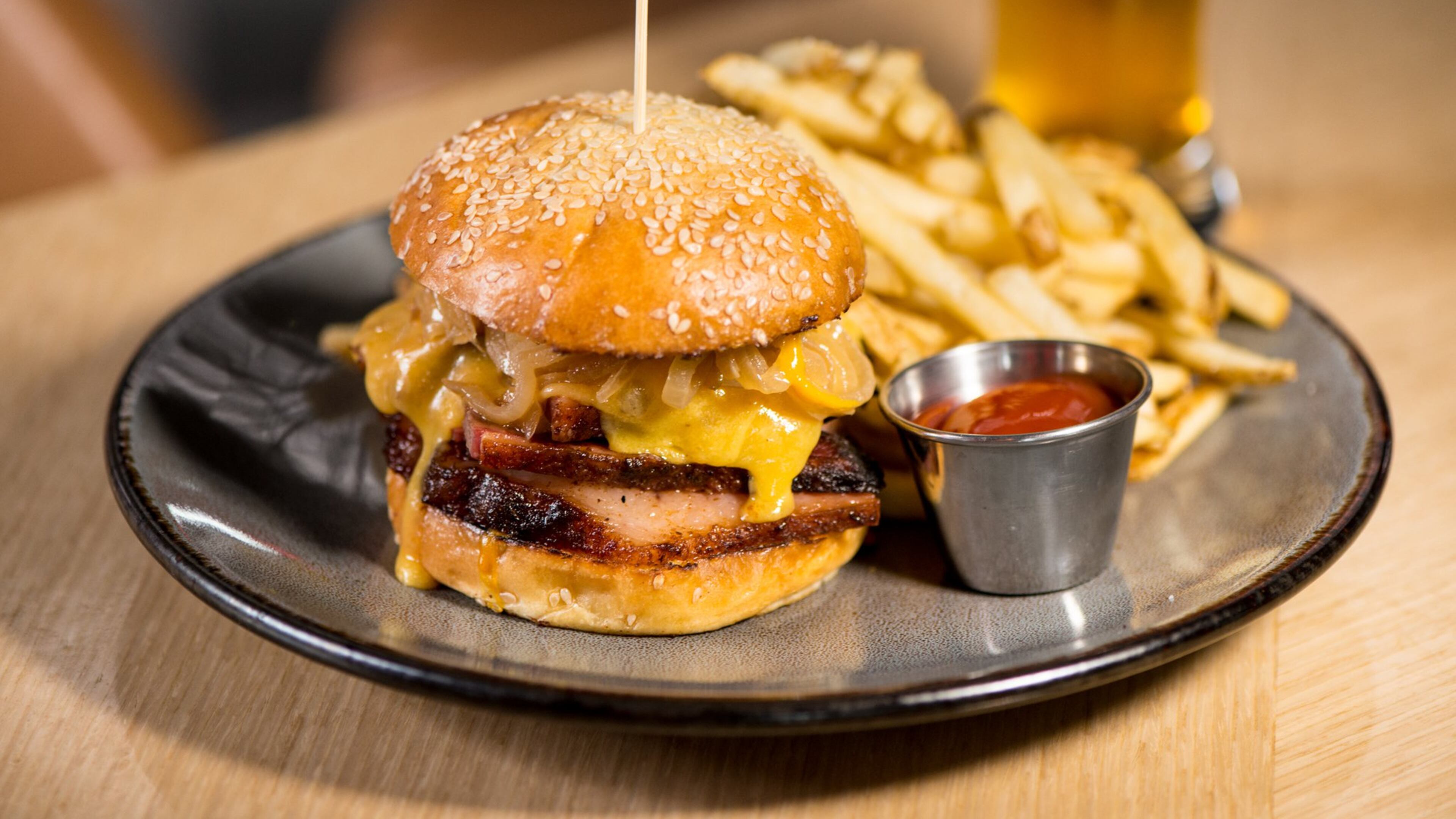 Molly B’s is named after Arthur Blank’s mother. One attempt to translate her recipes to a 2017 audience in the South is the Beef and Cheddar brisket sandwich with caramelized onions and hickory-mustard BBQ sauce. It’s shown with fries. CONTRIBUTED BY MIA YAKEL