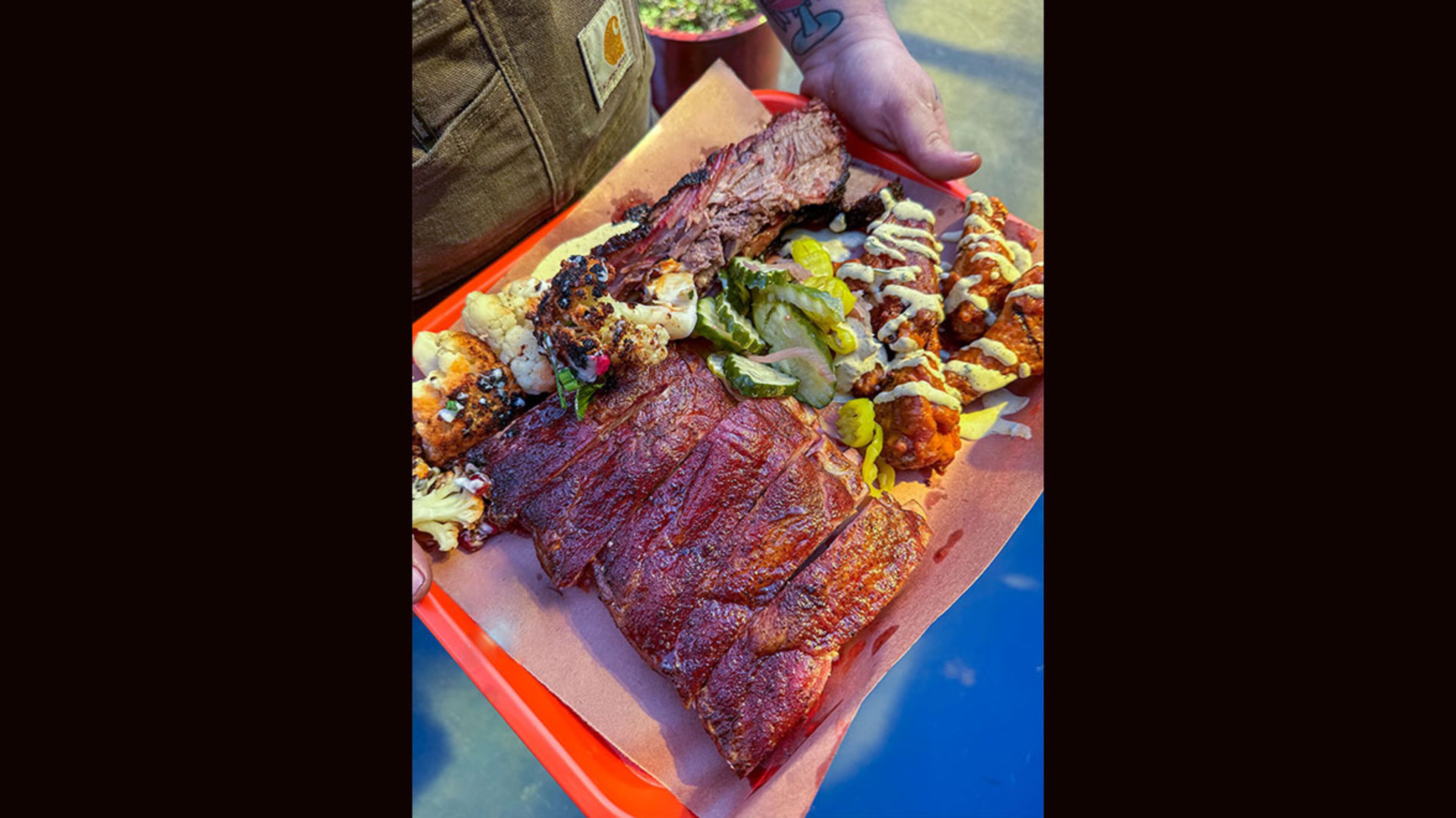 The menu at Gene's in Atlanta's East Lake neighborhood features a variety of smoked meats, appetizers and even vegetarian options. / Courtesy of Gene's