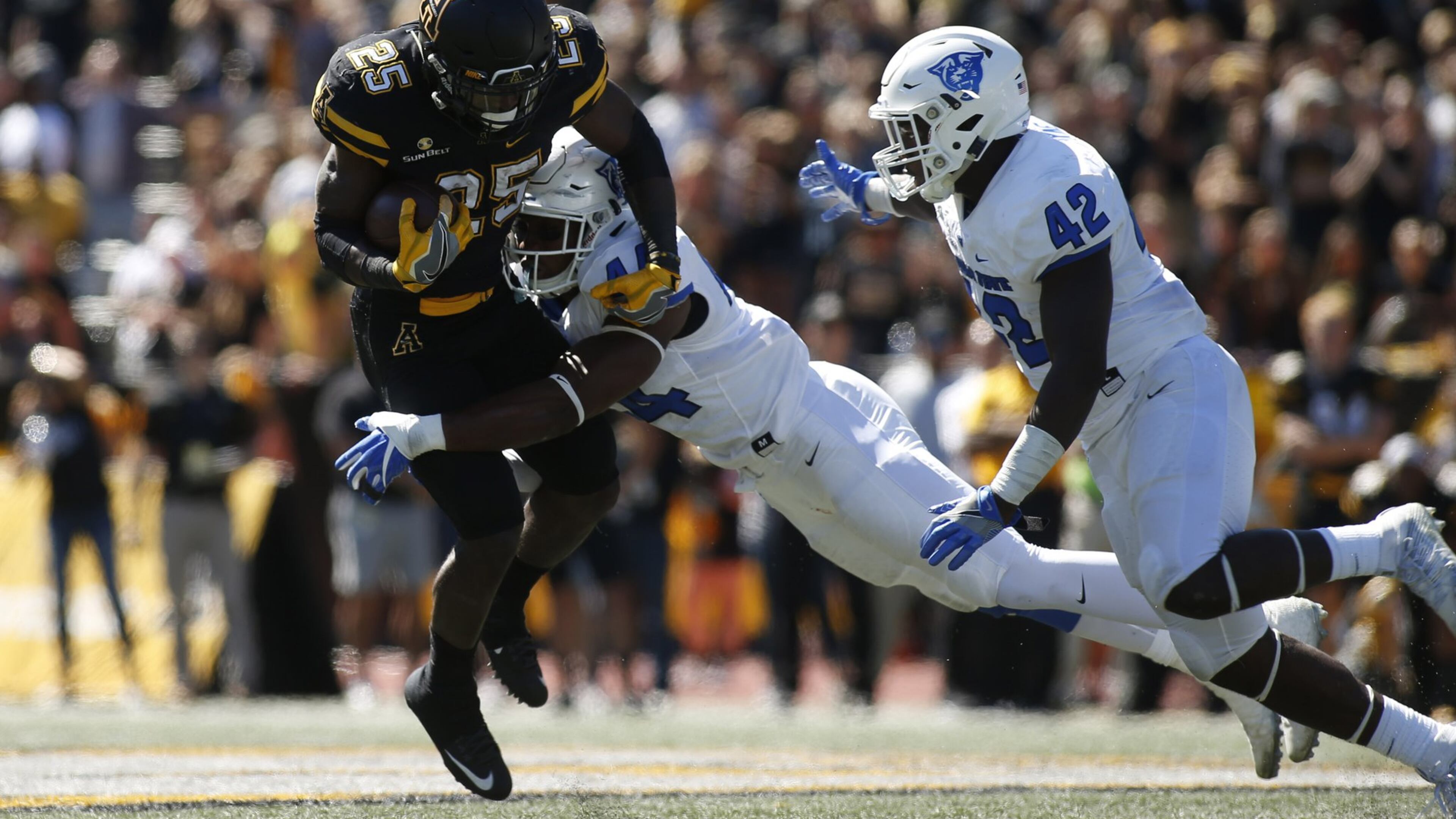 Running back Jalin Moore of Appalachian State is stopped on a carry by GSU linebacker Michael Shaw (44) and linebacker Trey Payne during the second quarter on Oct. 1, 2016 at Kidd Brewer Stadium in Boone, N.C. (Photo by Brian Blanco/Getty Images)