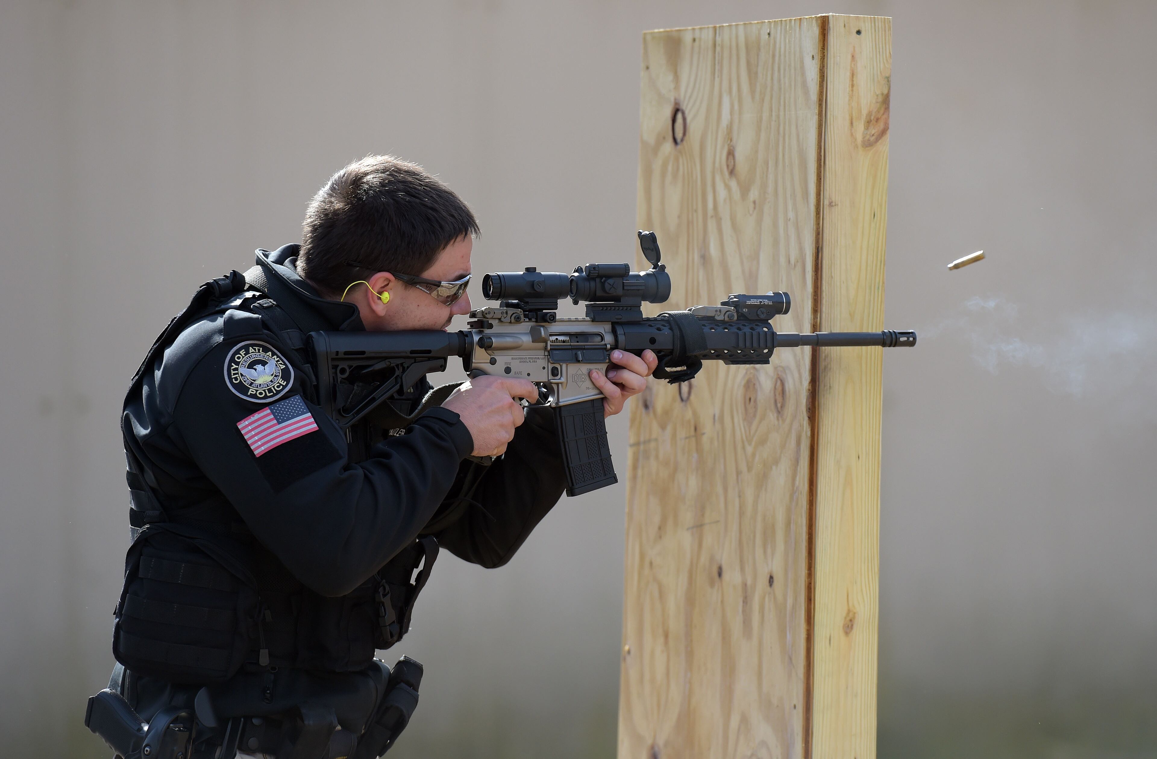 November 24, 2015 ATLANTA Spent cartridges fly as an Atlanta Police officer shoots during advanced patrol rifle training at the APD firearms range Tuesday, November 24, 2015. KENT D. JOHNSON/ kdjohnson@ajc.com