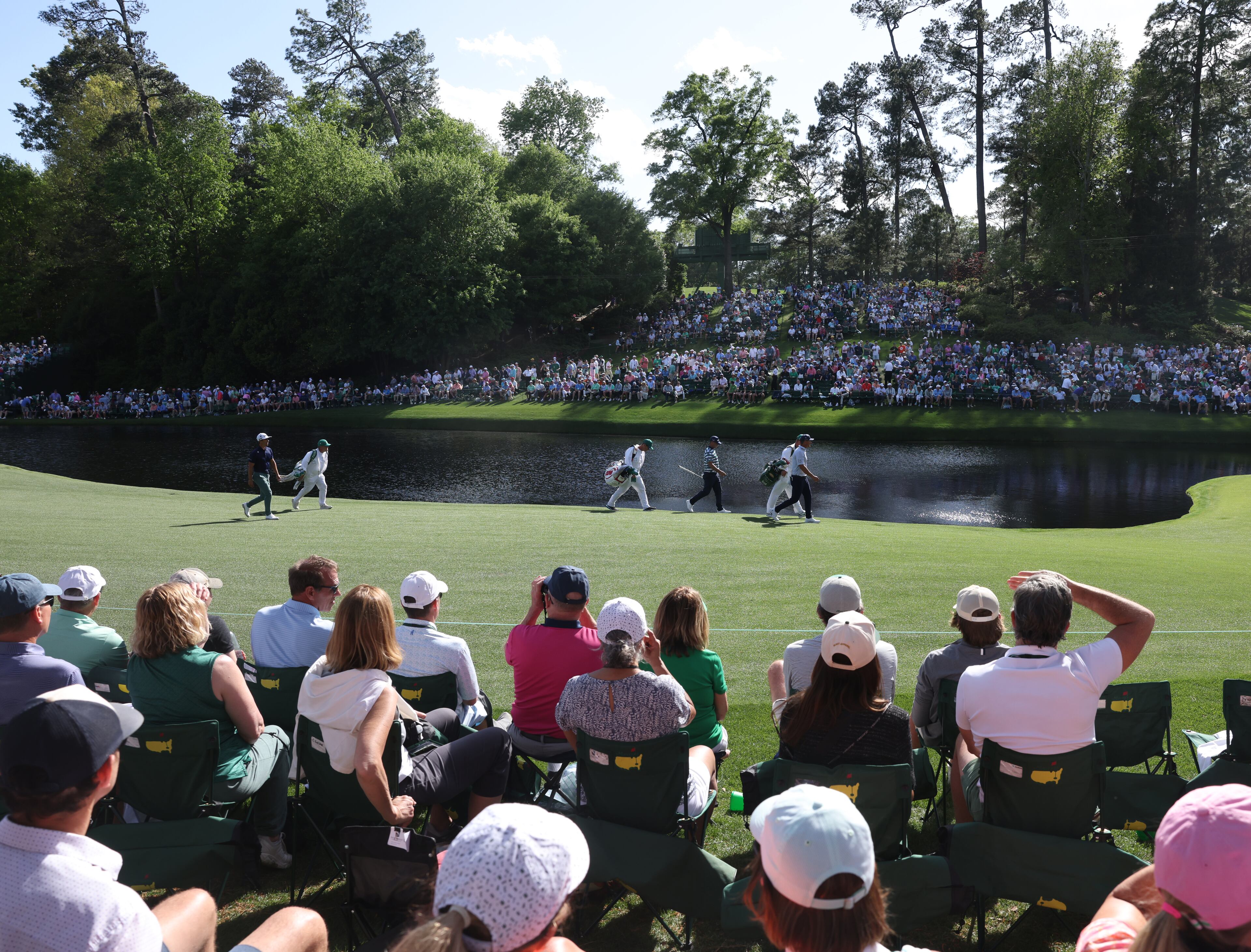 Gary Woodland, left and Bryson DeChambeau walk down 16 after their tee shots during second round of the 2024 Masters Tournament at Augusta National Golf Club, Friday, April 12, 2024, in Augusta, Ga. Jason Getz / Jason.Getz@ajc.com)