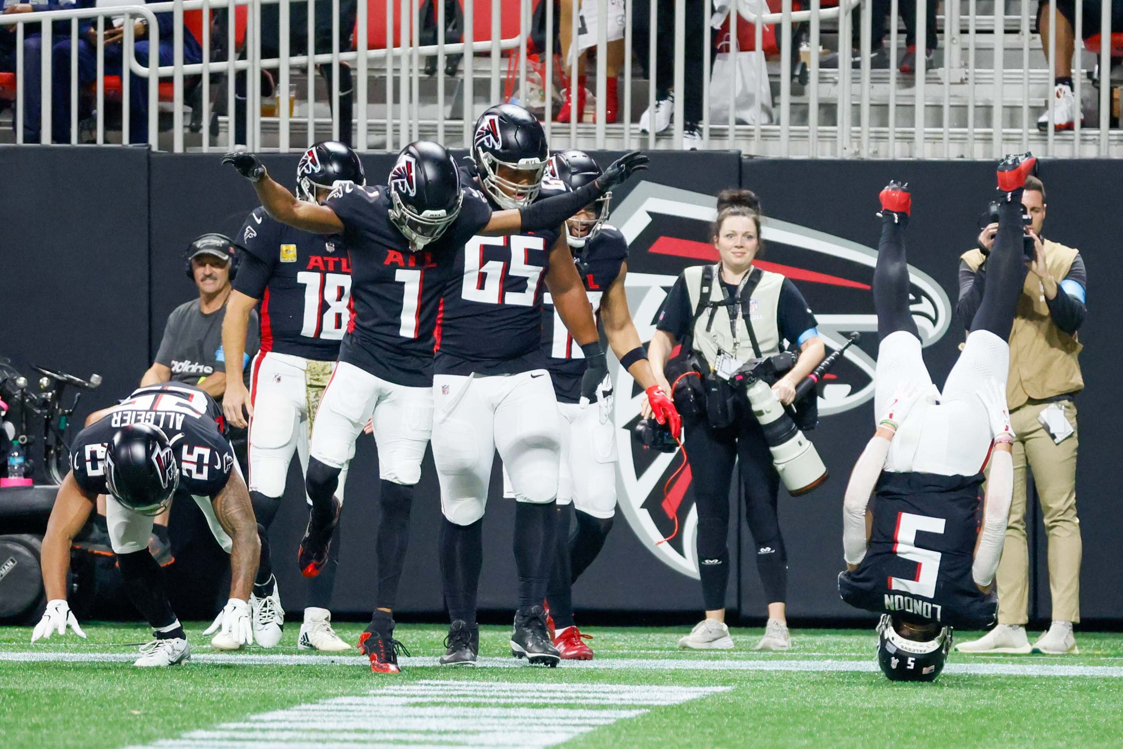Atlanta Falcons wide receiver Drake London (5) celebrates with teammates after scoring a touchdown during the first half of an NFL football game against the Dallas Cowboys on Sunday, November 3, 2024, at Mercedes-Benz Stadium in Atlanta.
(Miguel Martinez/ AJC)