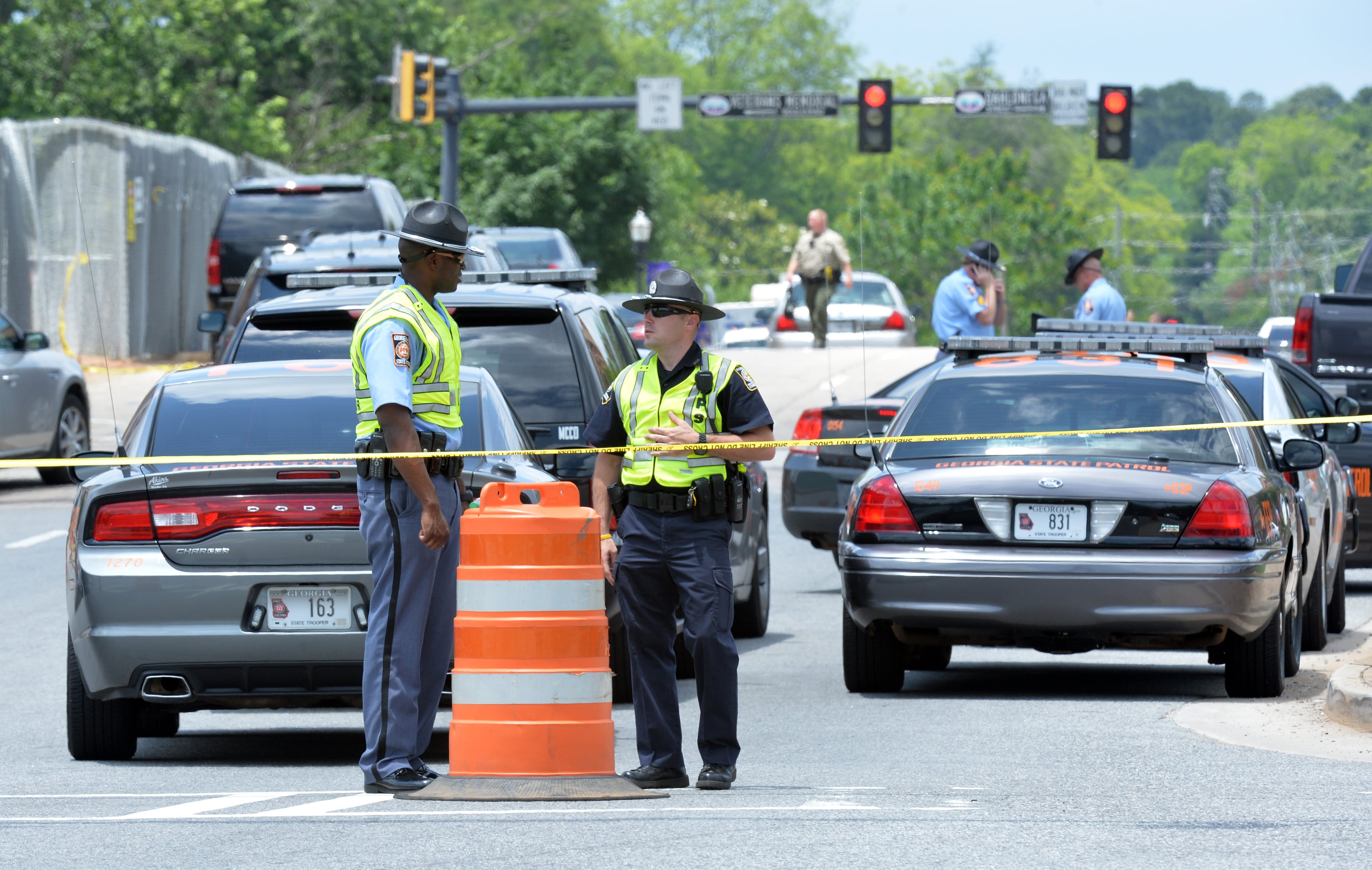 Law enforcement blocks streets near the Forsyth County courthouse after a man identified as a "sovereign citizen" assaulted the Forsyth County courthouse Friday, June 6, 2014, wounding a deputy before dying in a hail of bullets, officials said.
