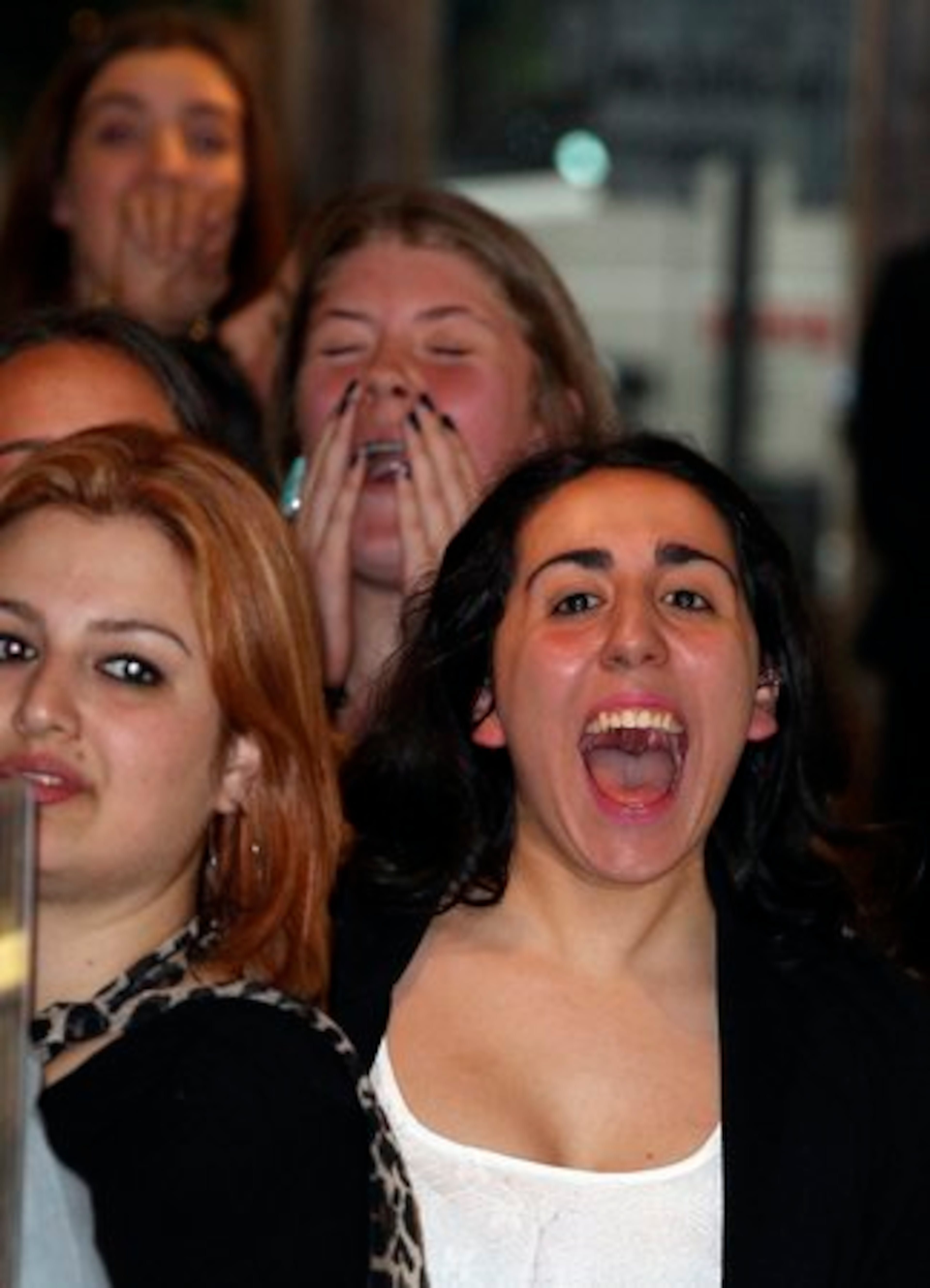 A fan screams for Kim as she takes her seat at the dais.