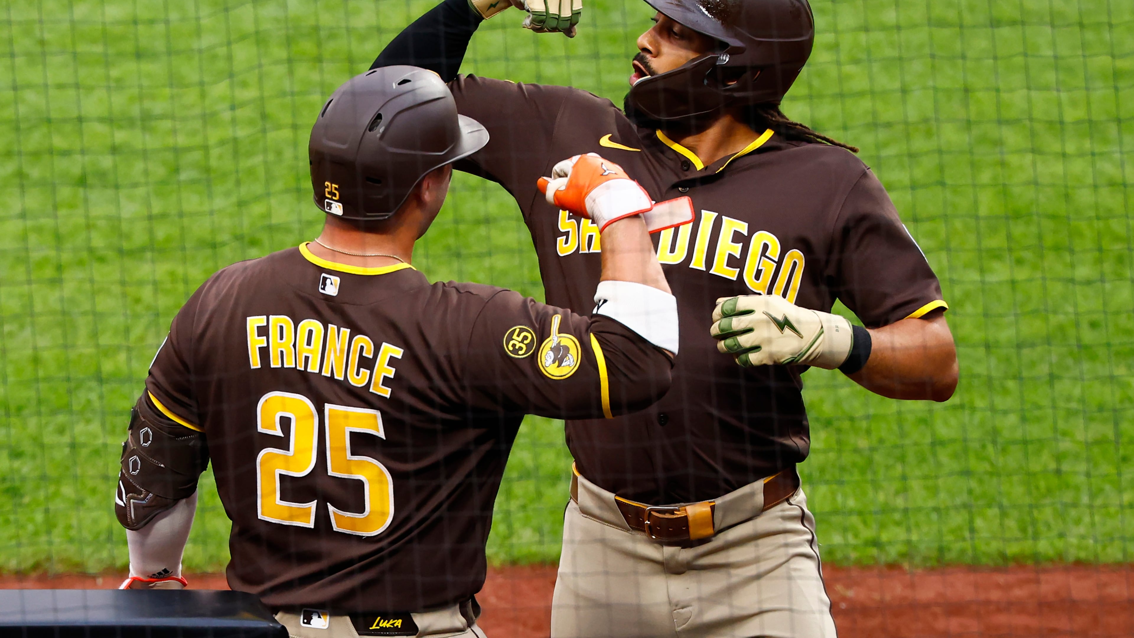 San Diego Padres' Fernando Tatis Jr. celebrates with Ty France (25) after hitting a home run against the New York Mets during the first inning of a baseball game, Tuesday, Aug. 18, 2026, in New York. (AP Photo/Noah K. Murray)