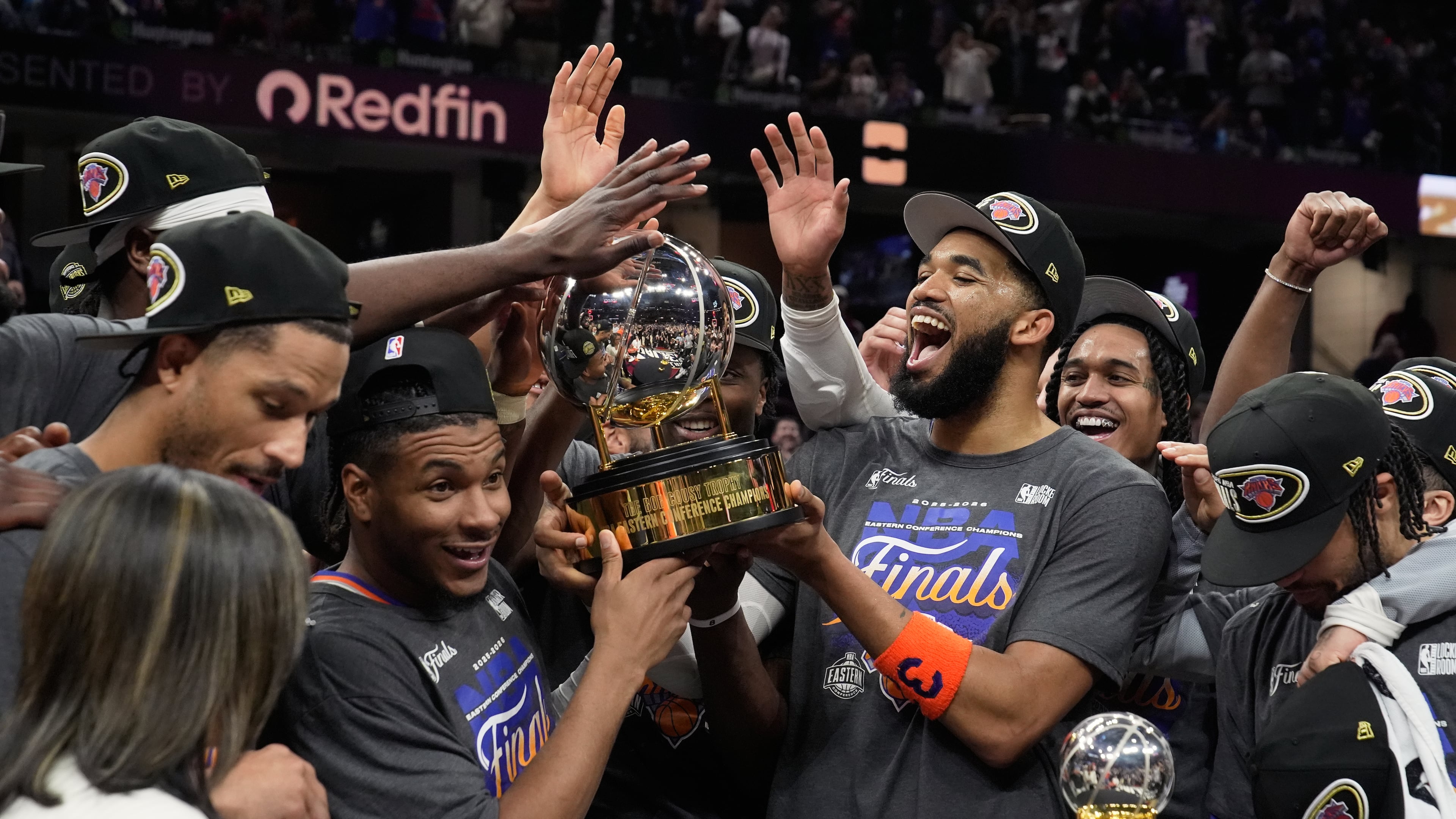 The New York Knicks hold the Eastern Conference Championship trophy after Game 4 in the Eastern Conference finals NBA basketball playoffs series against the Cleveland Cavaliers in Cleveland, Monday, May 25, 2026. (AP Photo/Sue Ogrocki)