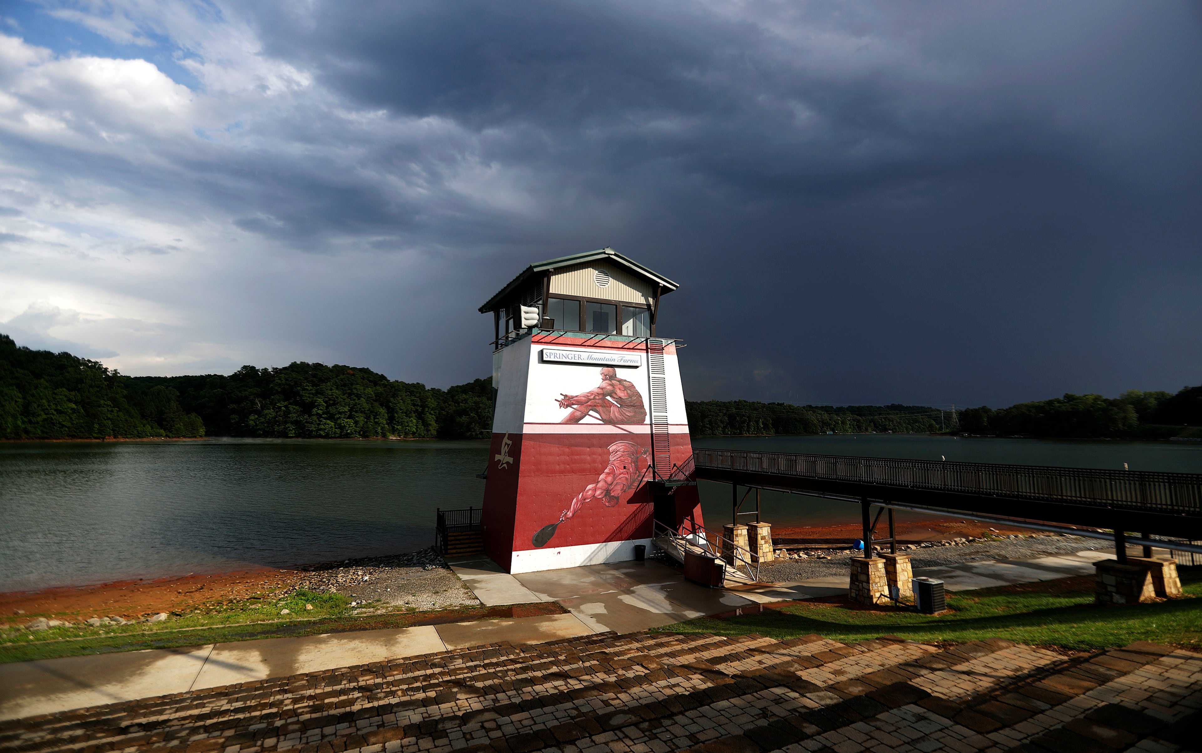 In this July 19, 2016 photo, the tower at Lake Lanier Olympic Park, home of the 1996 Summer Olympic Games rowing events, stands after being renovated in Gainesville, Ga. This man-made lake still has its rowing facilities, which have been used for major competitions over the last two decades. This year, it hosted an Olympic qualifier for Rio and will host the Dragon Boat World Championships in 2018. (AP Photo/David Goldman)