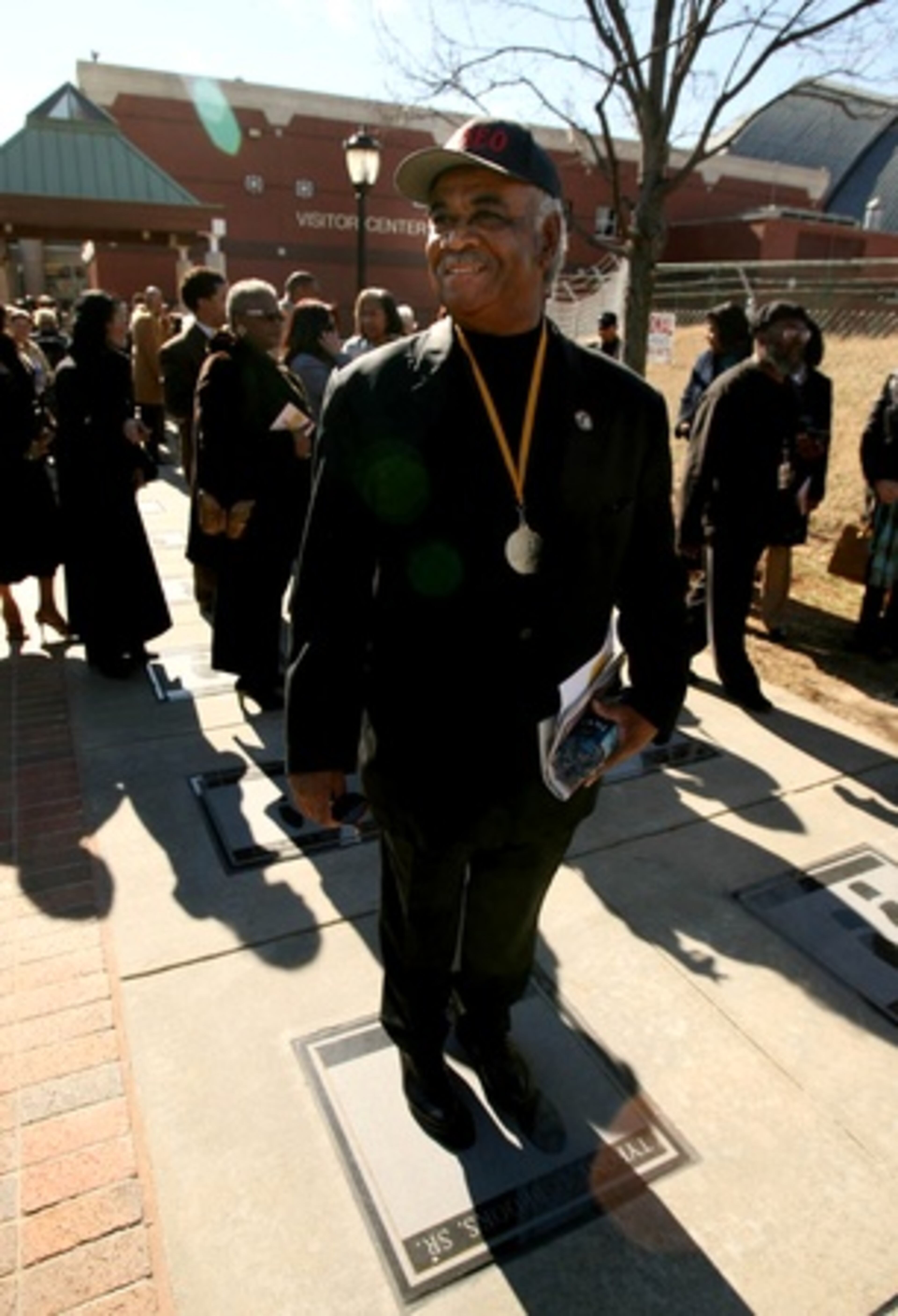 Georgia Rep. Tyrone Brooks Sr. stands on his foot prints. The Walk of Fame is a permanent outdoor exhibit of shoe prints belonging to those who have made a difference in the fight for racial equality.