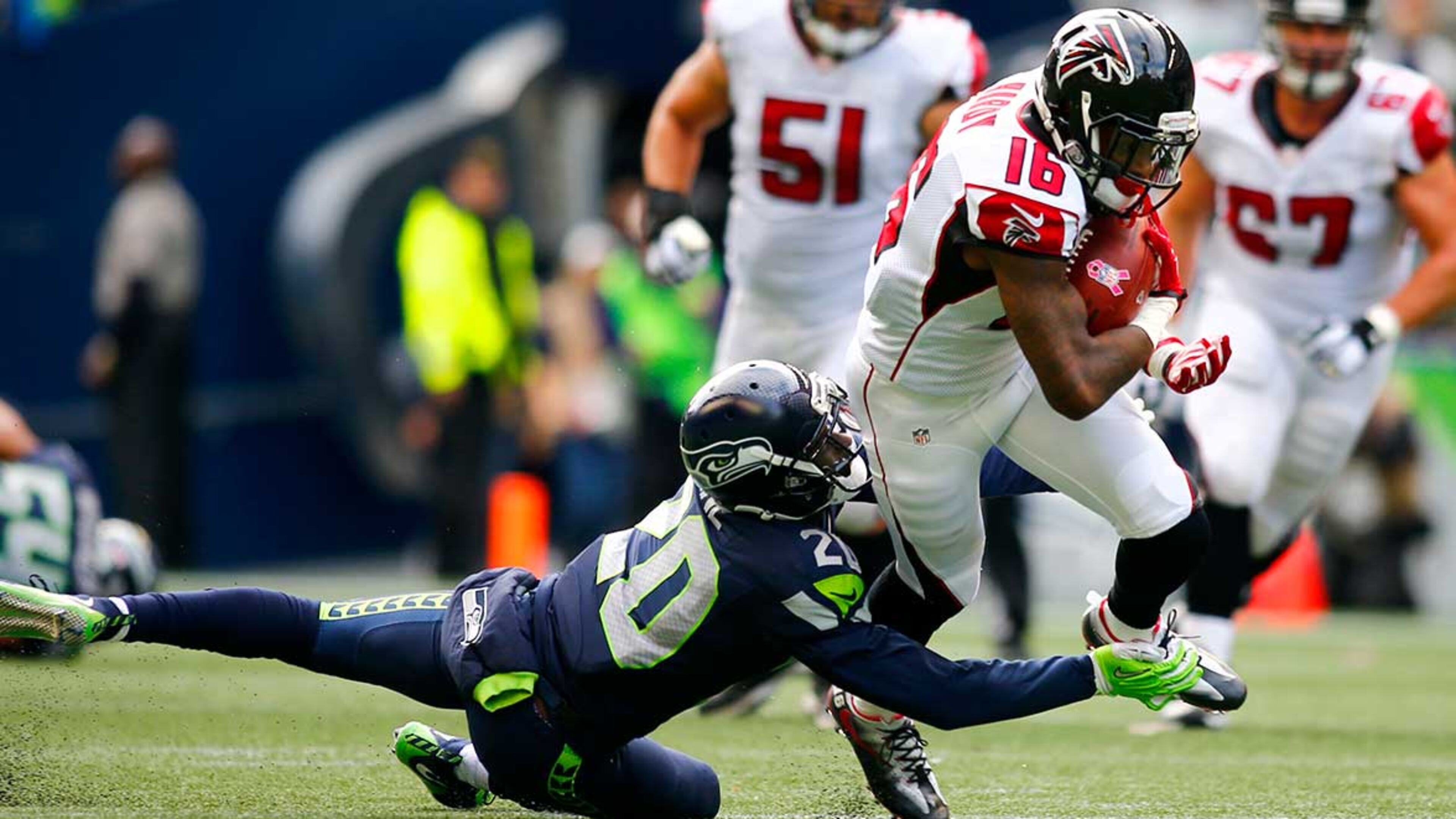 Justin Hardy tries to break free from the tackle attempt by Jeremy Lane during October's regular-season game in Seattle.