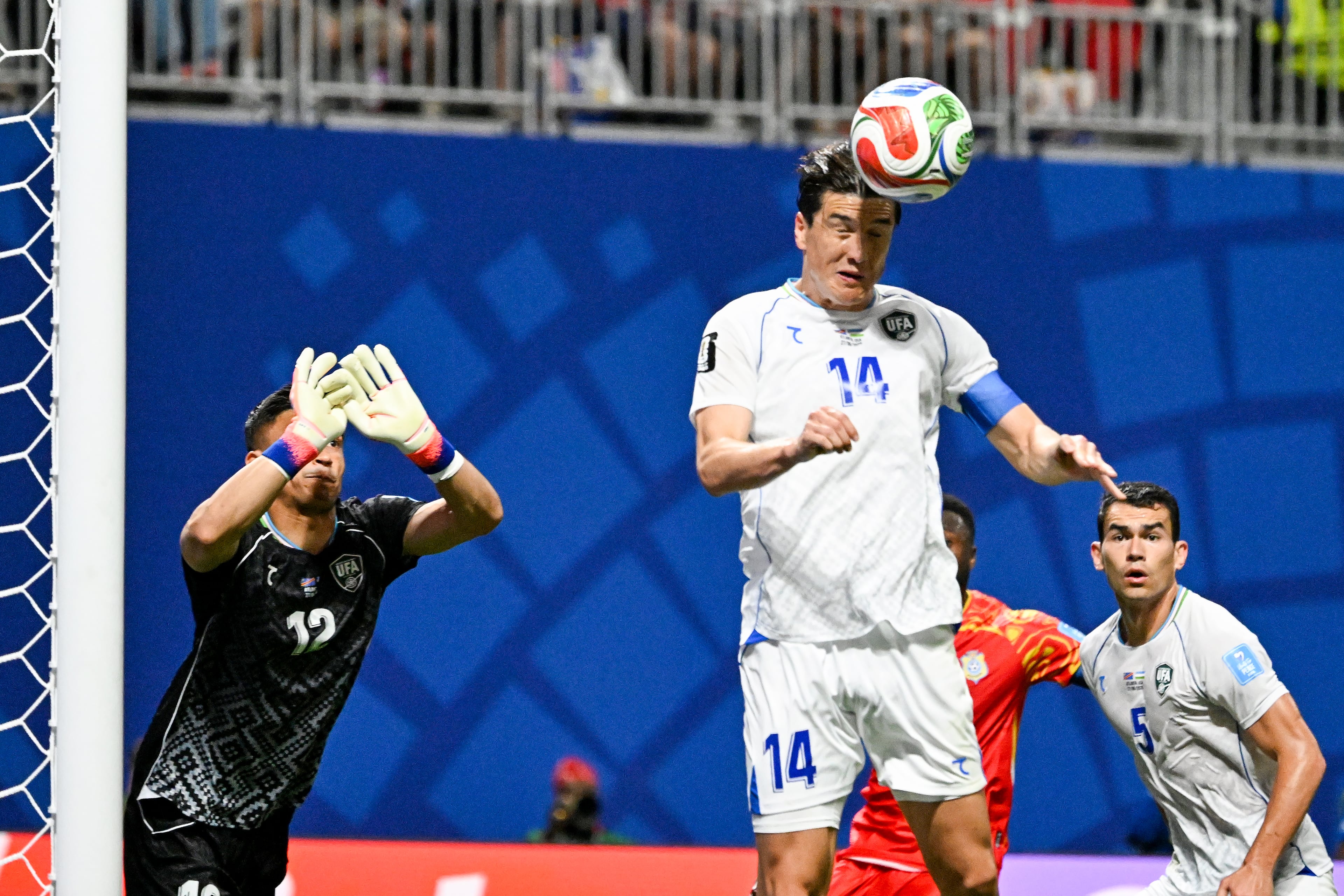 Uzbekistan forward Eldor Shomurodov (center) heads the ball away from his team's goal during the first half of a FIFA World Cup match at Atlanta Stadium (Mercedes-Benz Stadium) on Saturday, June 27, 2026, in Atlanta. (Hyosub Shin/AJC)