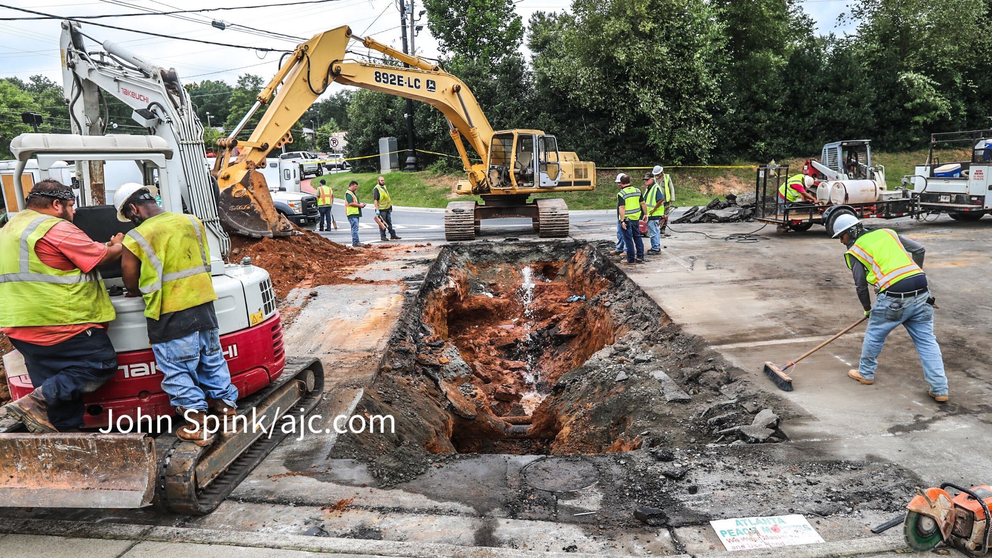 Allgood Road is closed near Cobb Parkway on Friday as crews repair a large sinkhole that formed overnight near the Marietta intersection.