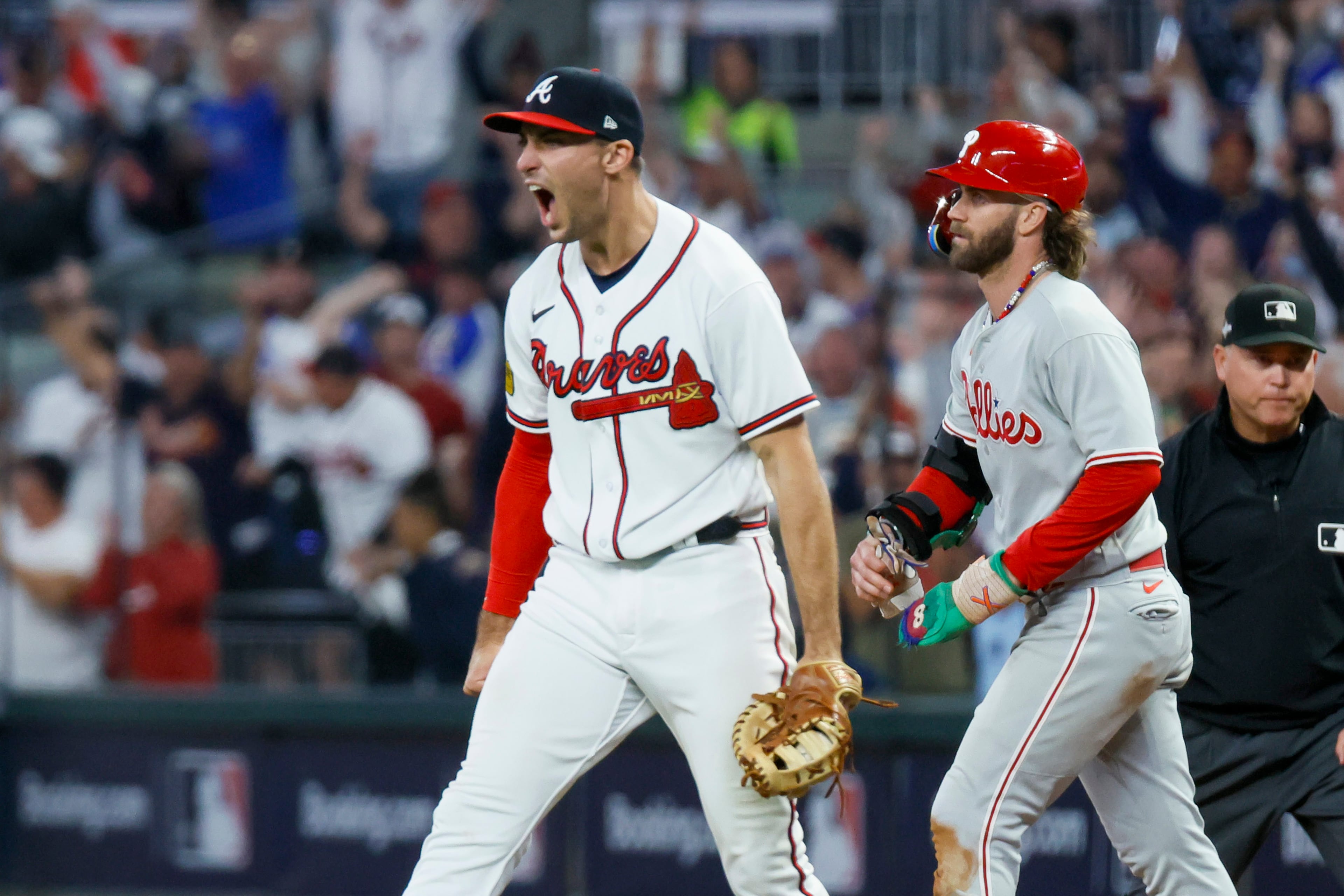Atlanta Braves first baseman Matt Olson (28) reacts after forcing out Philadelphia Phillies’ Bryce Harper at first base on a fly out by Nick Castellanos to end the ninth inning of NLDS Game 2 in Atlanta on Monday, Oct. 9, 2023. (Miguel Martinez / Miguel.Martinezjimenez@ajc.com)