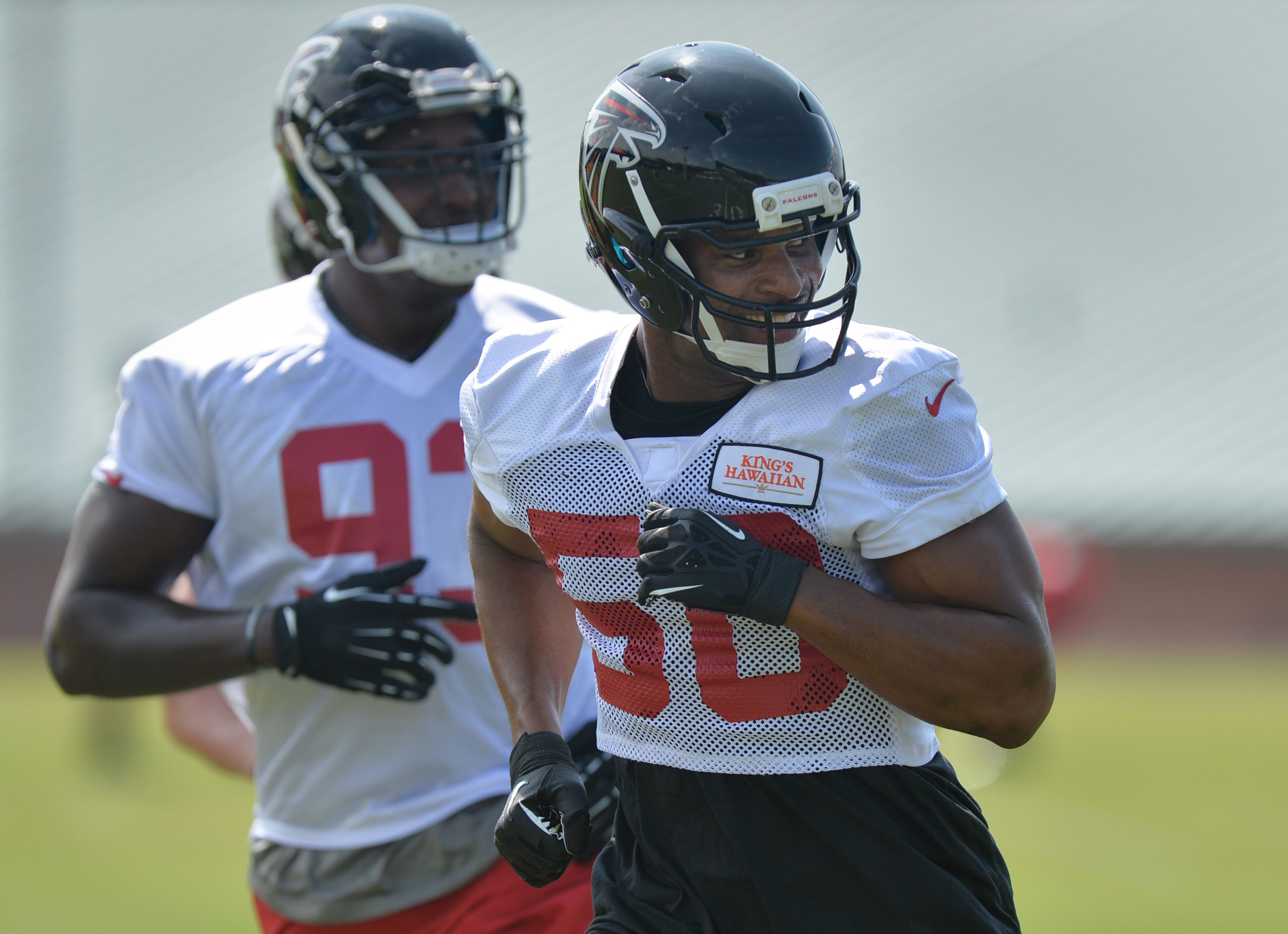 Atlanta Falcons defensive end Osi Umenyiora runs during training camp on Friday, July 25, 2014.