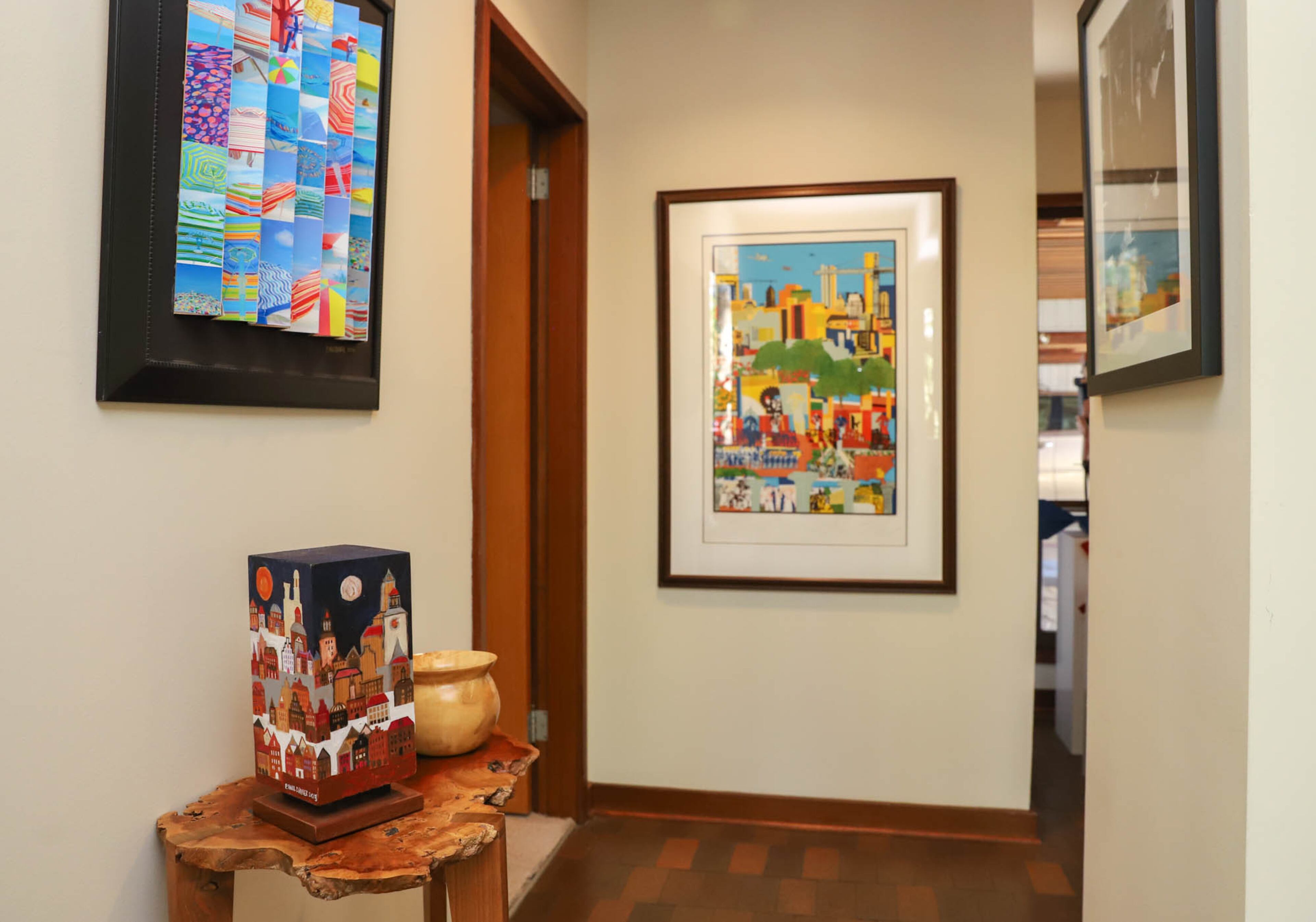 The hallways of Paul and Carol Muldawer’s home were designed to work like European streets, terminating in stunning works of art the way streets in Europe tend to end at iconic buildings. In the front hall they have a wood table by Jeffrey Oh and a piece called Sky that Paul created himself. Text by Shannon Dominy/Photo by Reynolds Rogers