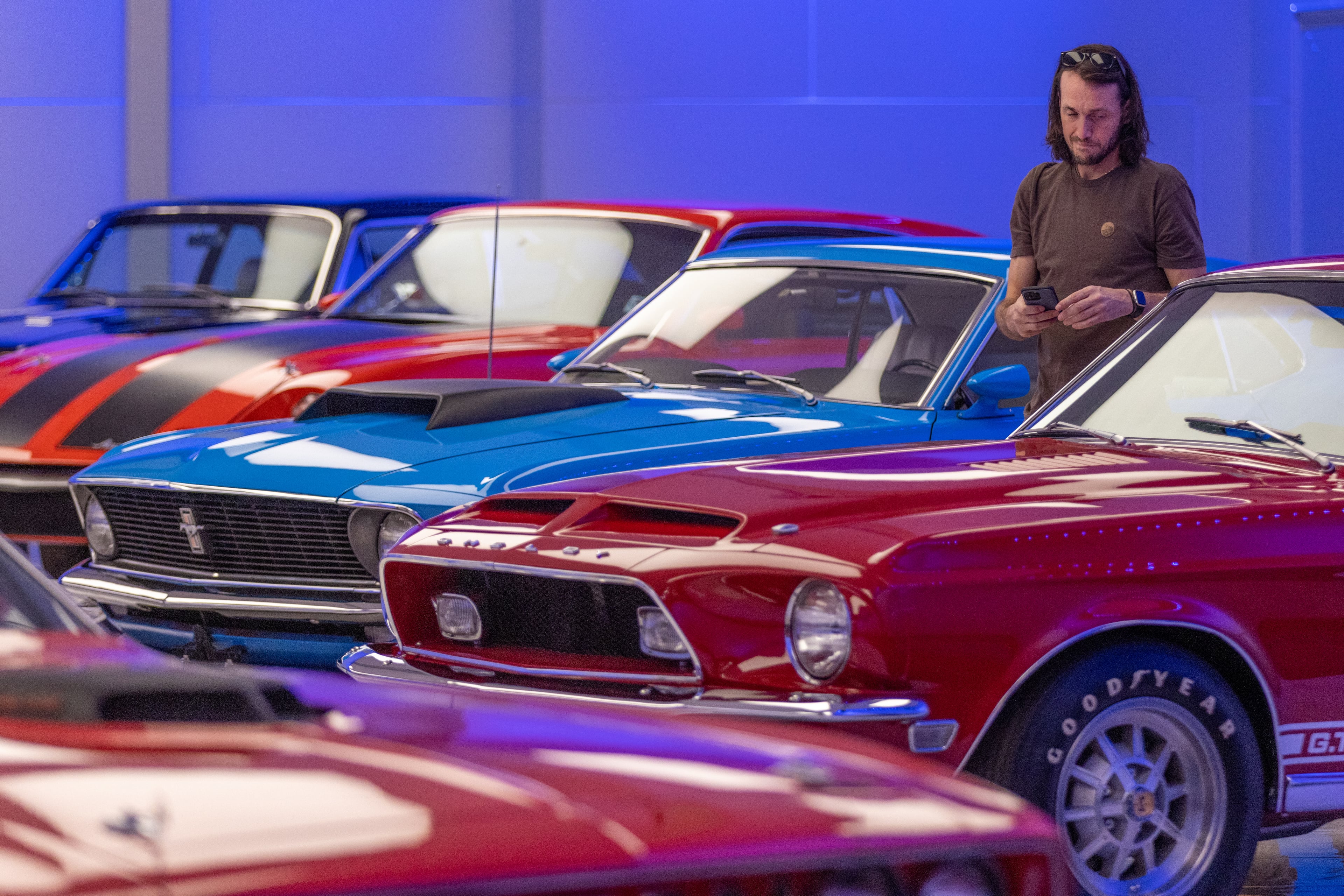 Brandon Wafrock looks over the muscle cars on exhibit at the Savory Automobile Museum in Cartersville. Steve Schaefer/steve.schaefer@ajc.com)