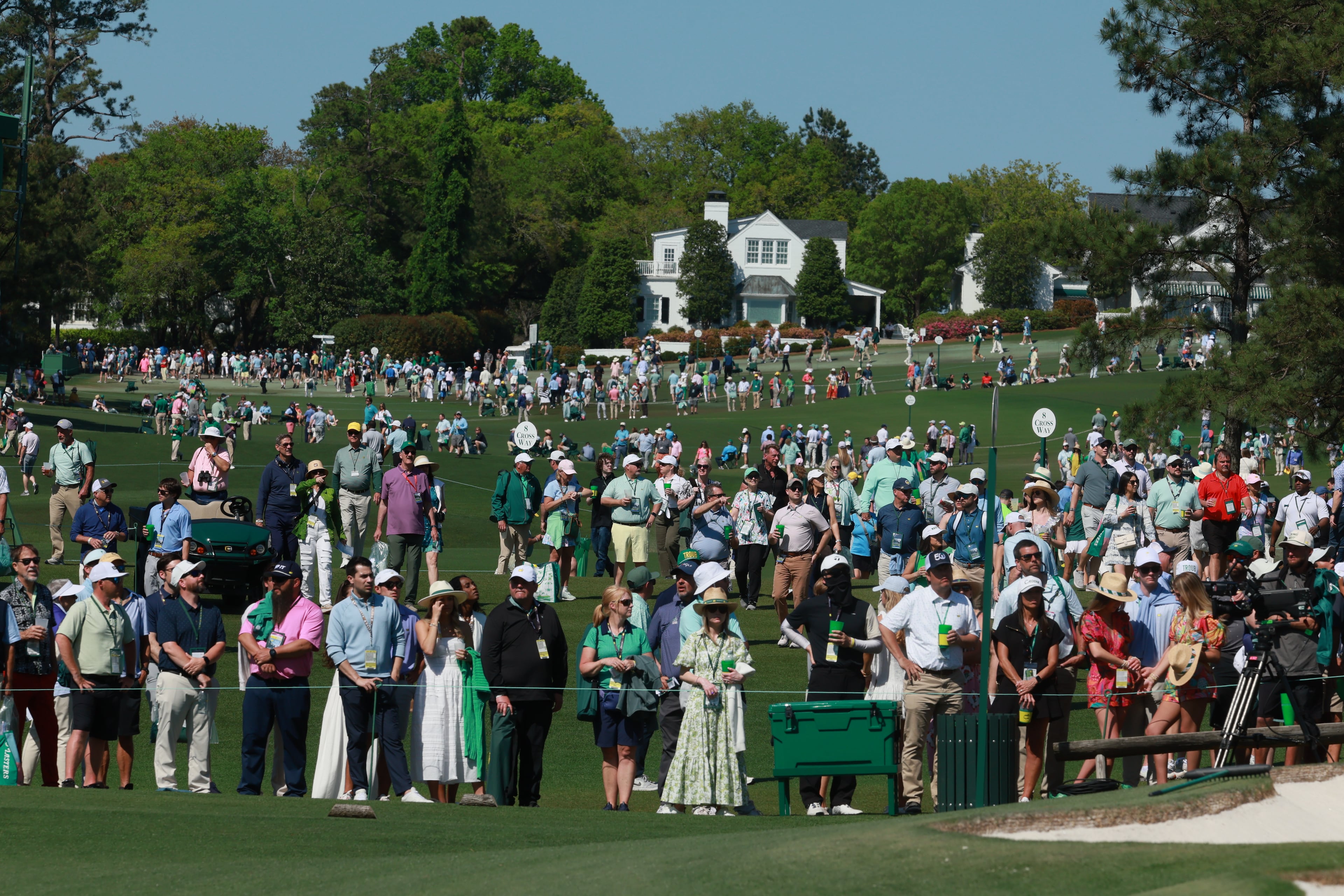 Patrons watch golf action from seventh green during final round of the Masters golf tournament, at Augusta National Golf Club, Saturday, April 13, 2025, in Augusta, Ga. (Jason Getz / AJC)