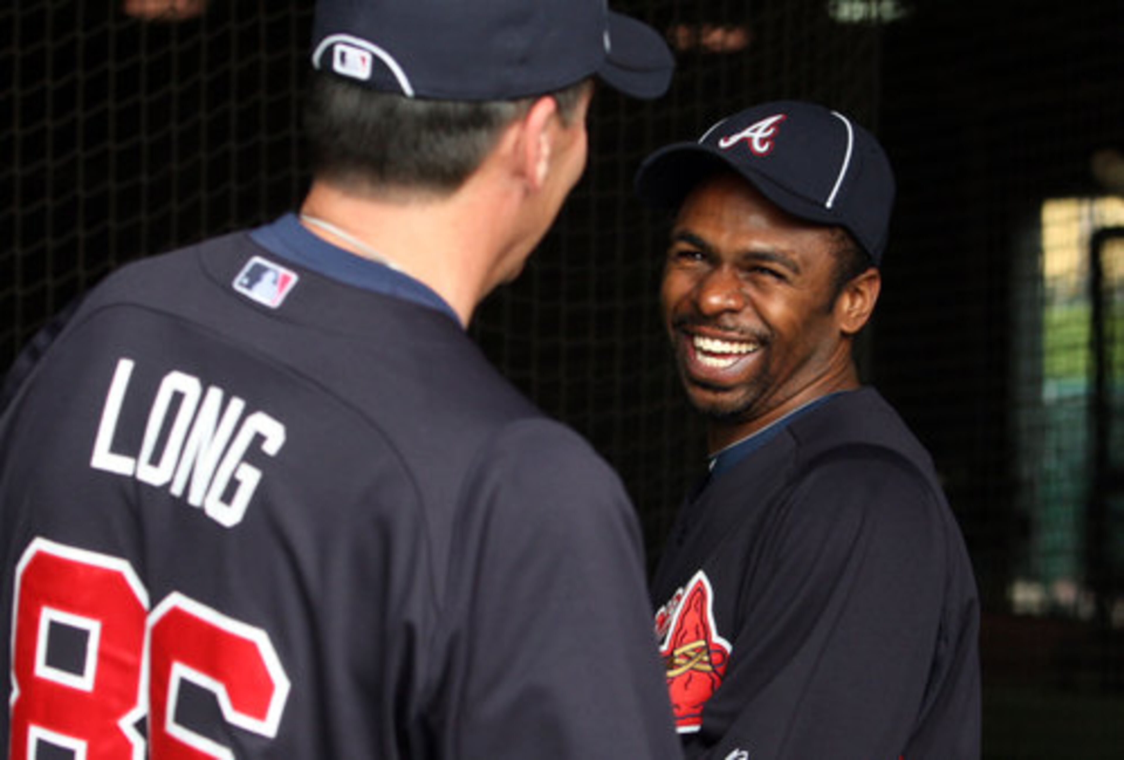 Braves minor-league hitting coordinator Don Long greets center fielder Michael Bourn on Wednesday, Feb. 22, 2012, his first day at camp in Lake Buena Vista, Fla.