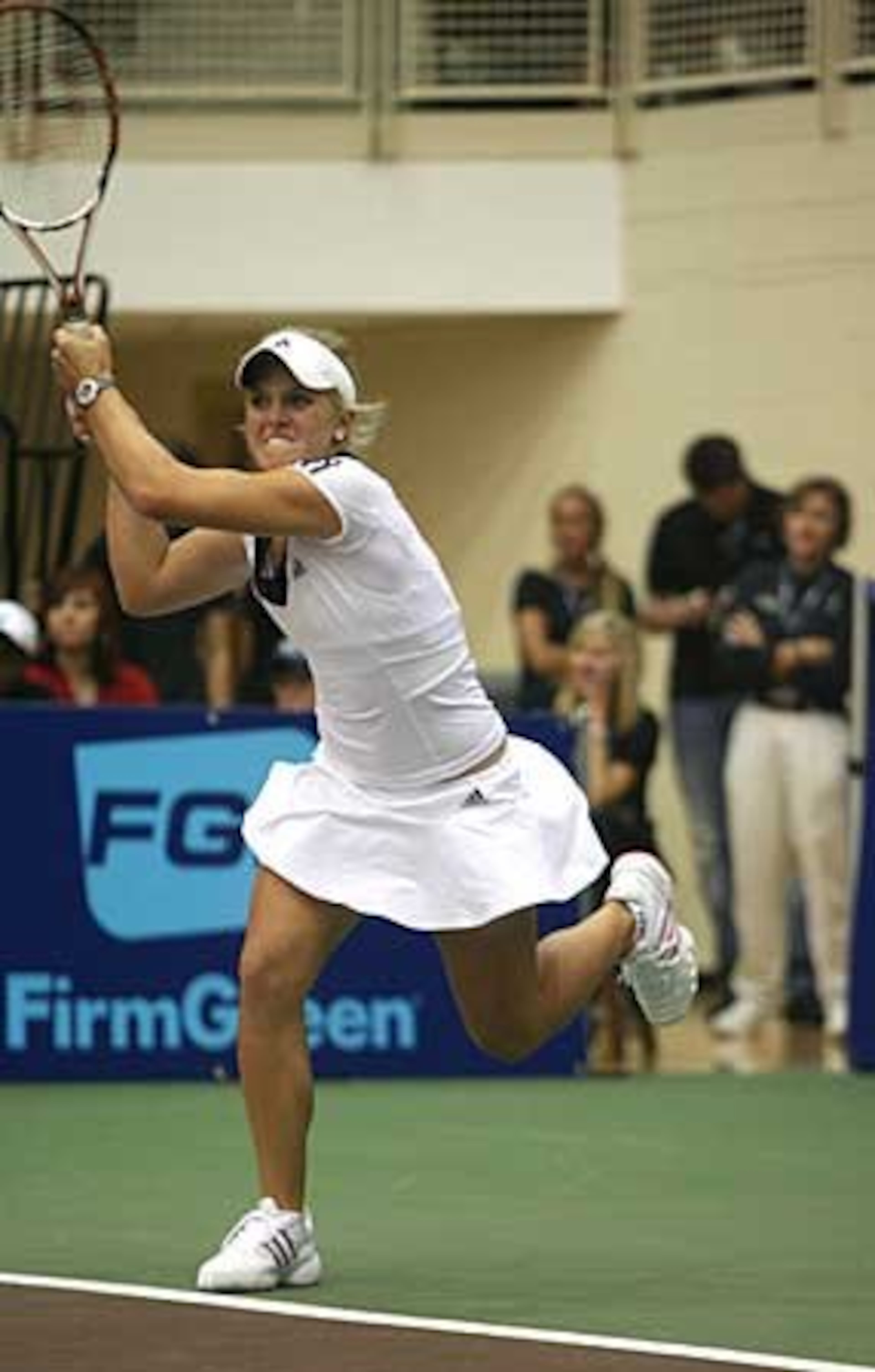Melanie Oudin, 17, of Marietta takes on Martina Navratilova in a singles match during the Advanta WTT Smash Hits tennis event at Kennesaw State University. Oudin is the top ranked American junior player and No. 2 in the world.