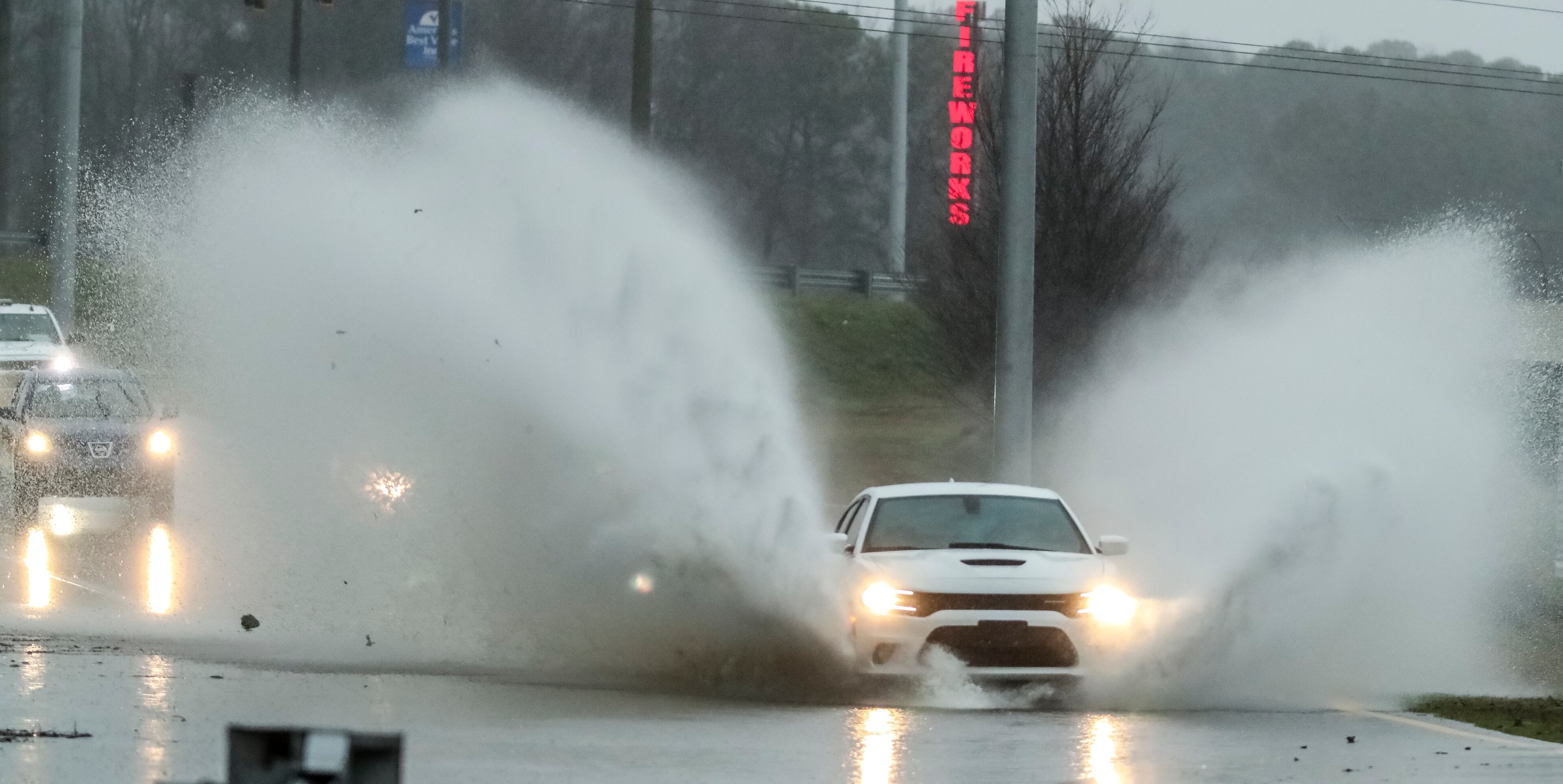 Motorists in Douglasville experienced pooling water on the interstates like this one shown splashing out a wave of water on the on-ramp to Westbound I-20 from Fairburn Road in Douglasville. A deluge fell across metro Atlanta on Thursday, Feb. 6, 2020 as motorists experienced a challenging day on the roads. JOHN SPINK/JSPINK@AJC.COM