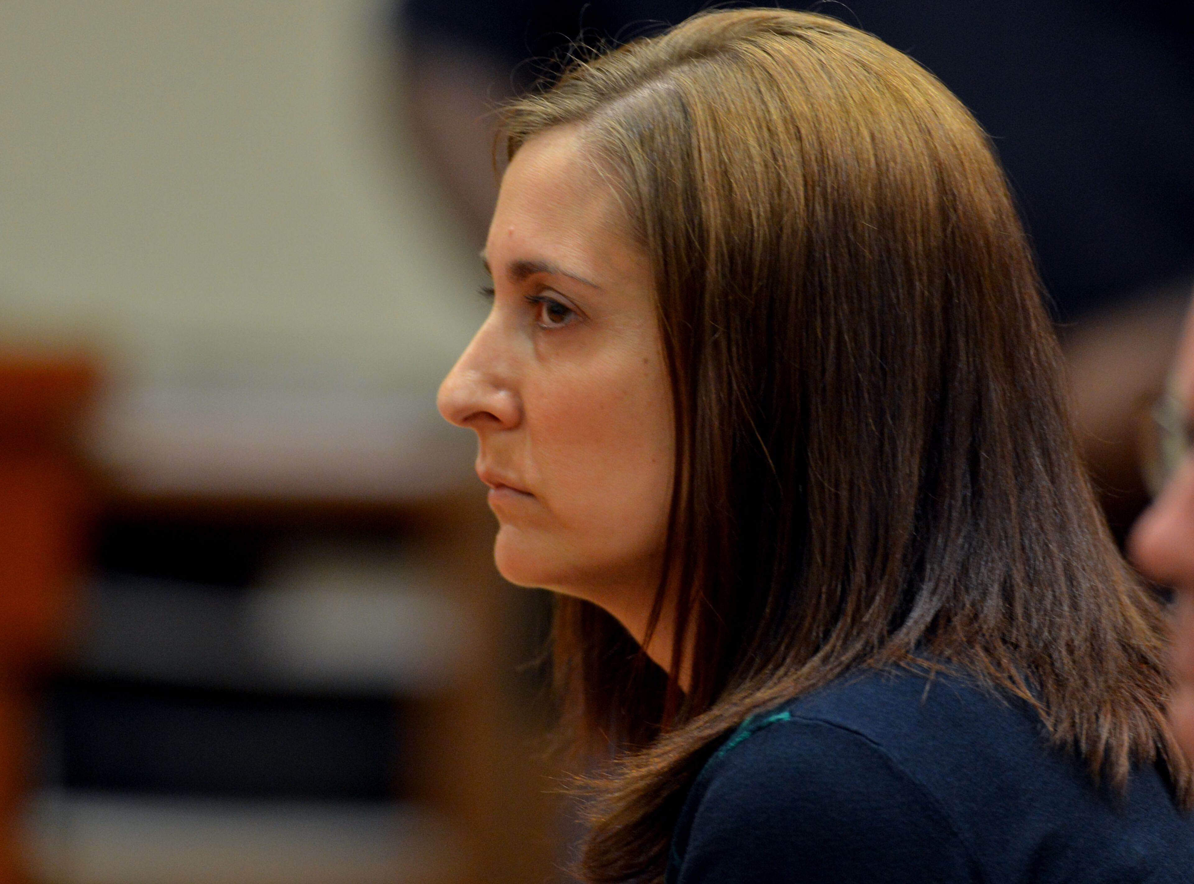 Andrea Sneiderman listens as the jury is polled on the verdict.