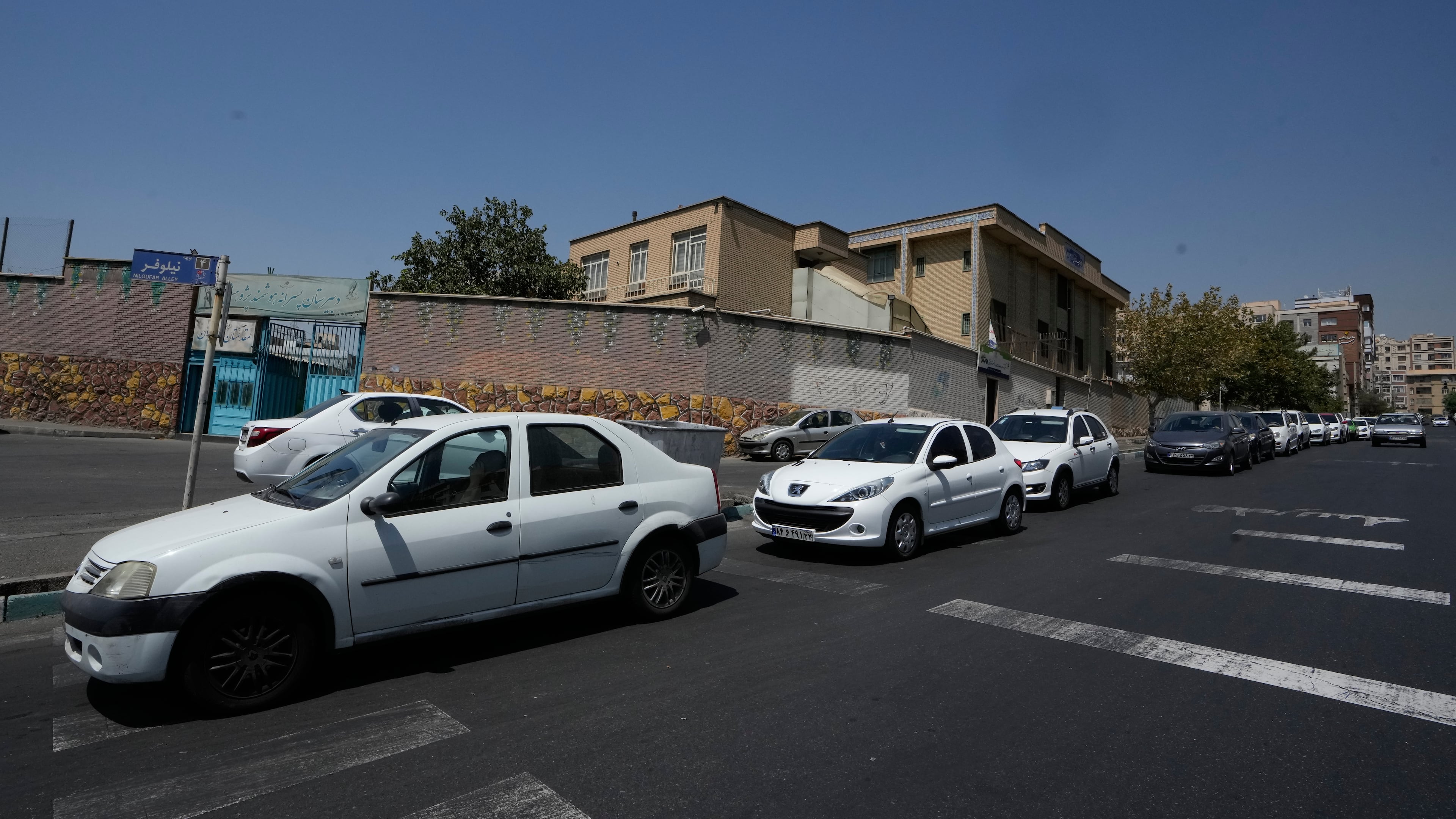 Cars line up outside a gas station in Tehran, Iran, Tuesday, Aug. 25, 2026. (AP Photo/Vahid Salemi)