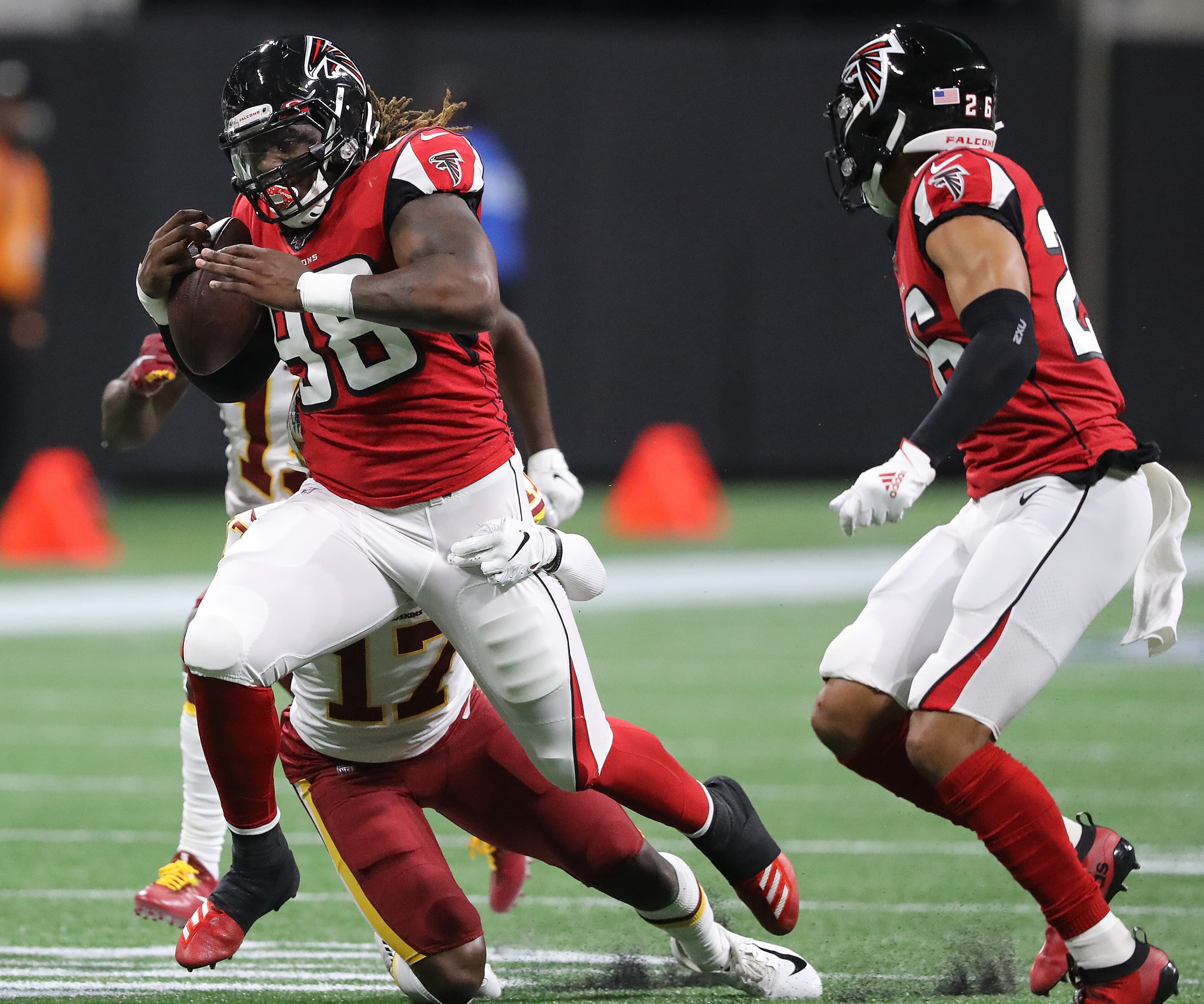 Falcons defensive end Takk McKinley intercepts during the second quarter. Curtis Compton/ccompton@ajc.com