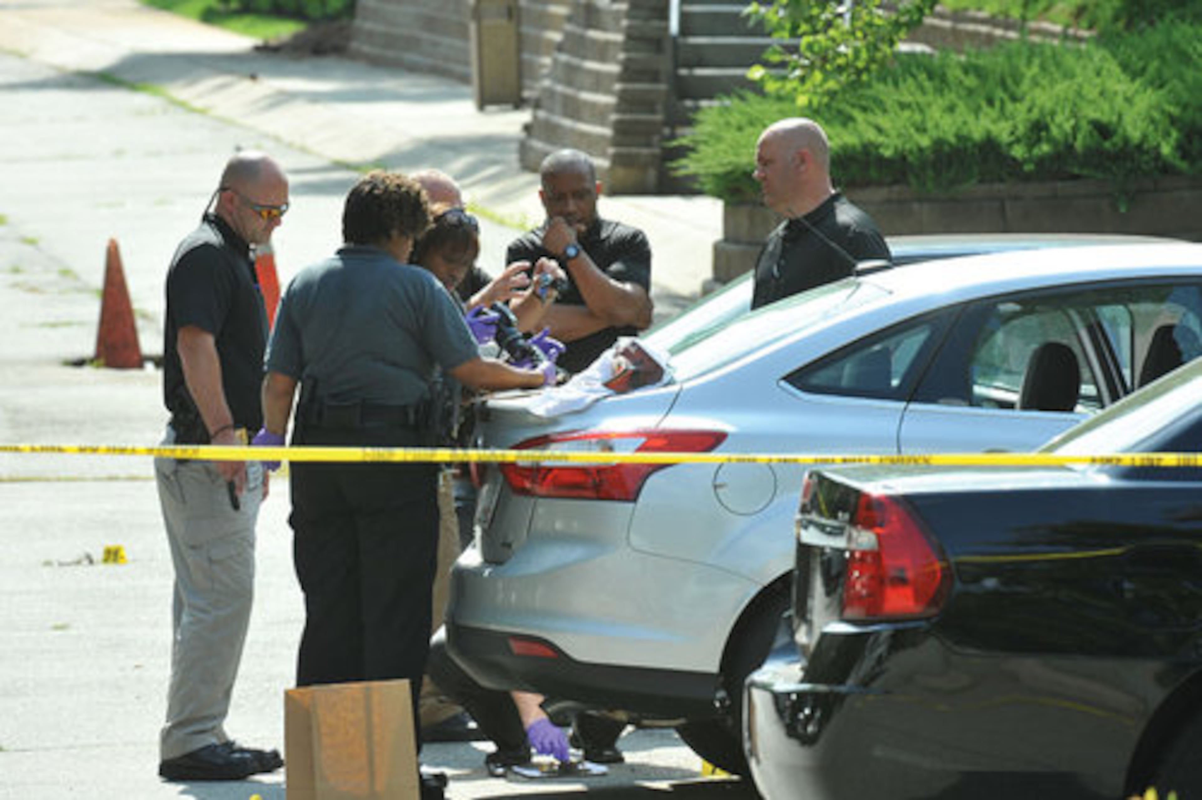 Investigators photograph evidence.