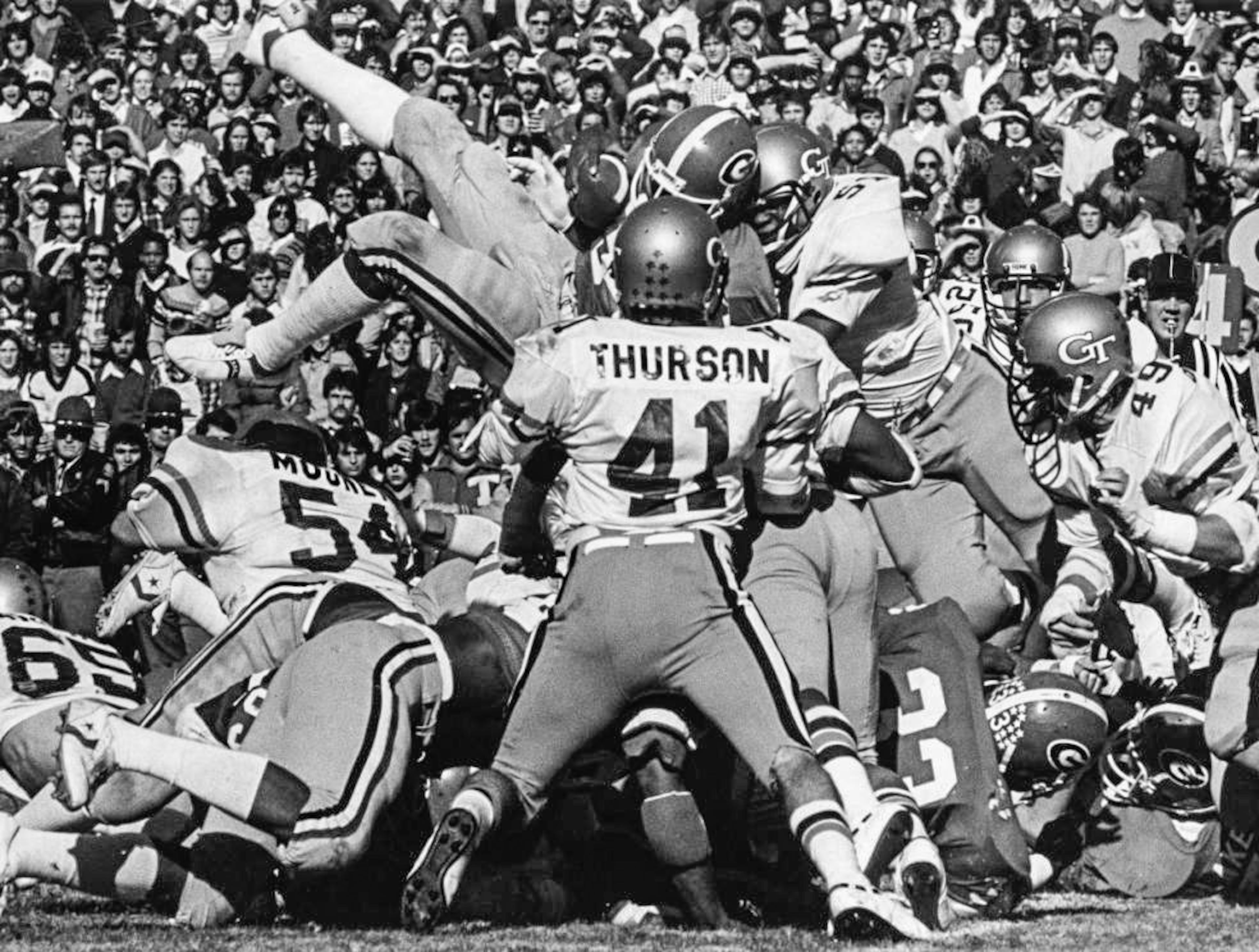 Herschel Walker leaps over the defensive line in an attempt to gain yardage against Georgia Tech, 1980