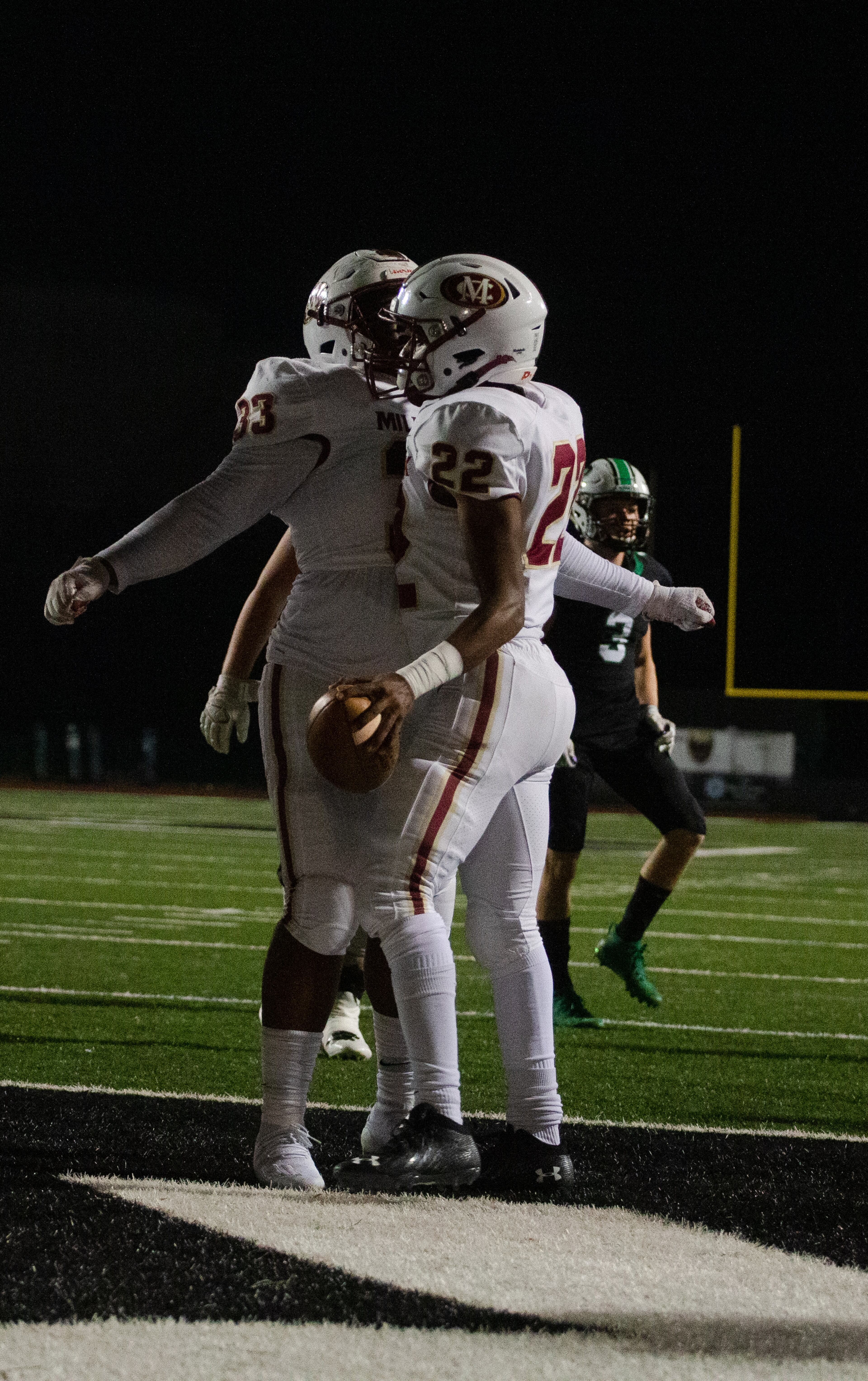 Donovan Journey (right), junior running back for Mill Creek, and Christian Mcintyre (left), senior full back for Mill Creek, chest bump after scoring a touchdown during the Mill Creek vs. Roswell high school football game on Friday, November 27, 2020, at Roswell High School in Roswell, Georgia. Mill Creek led Roswell 27-21 at the end of the third quarter. CHRISTINA MATACOTTA FOR THE ATLANTA JOURNAL-CONSTITUTION
