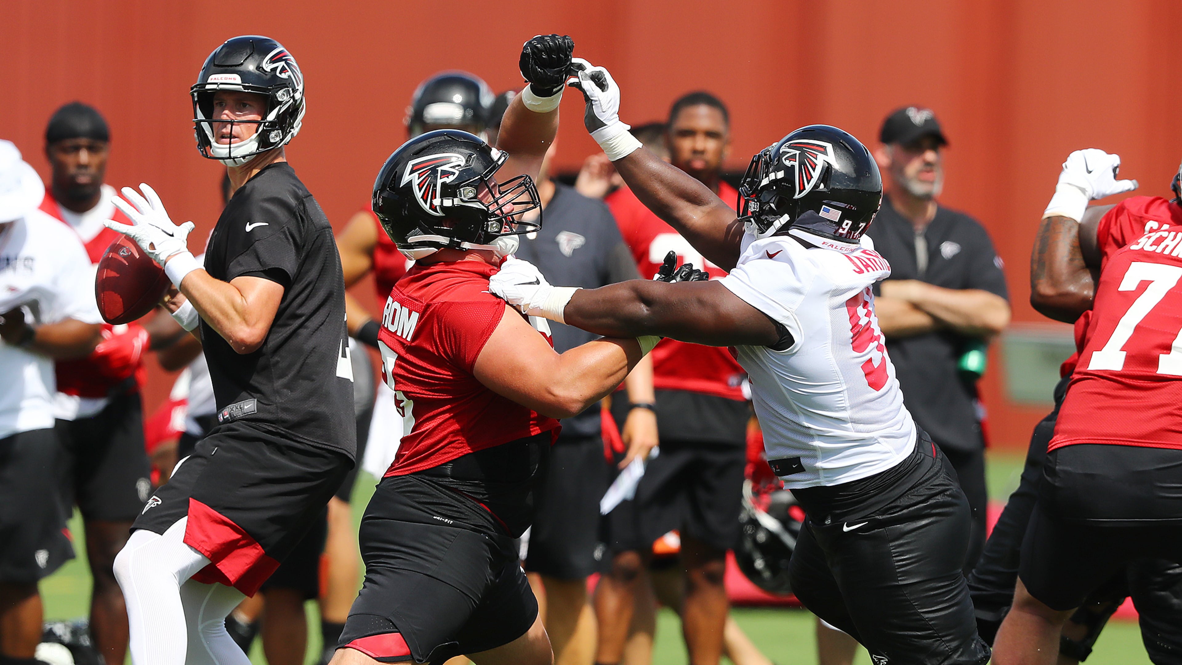 Falcons first rookie offensive lineman Chris Lindstrom blocks the rush of defensive tackle Grady Jarrett during the first practice of training camp Monday, July 22, 2019, in Flowery Branch.