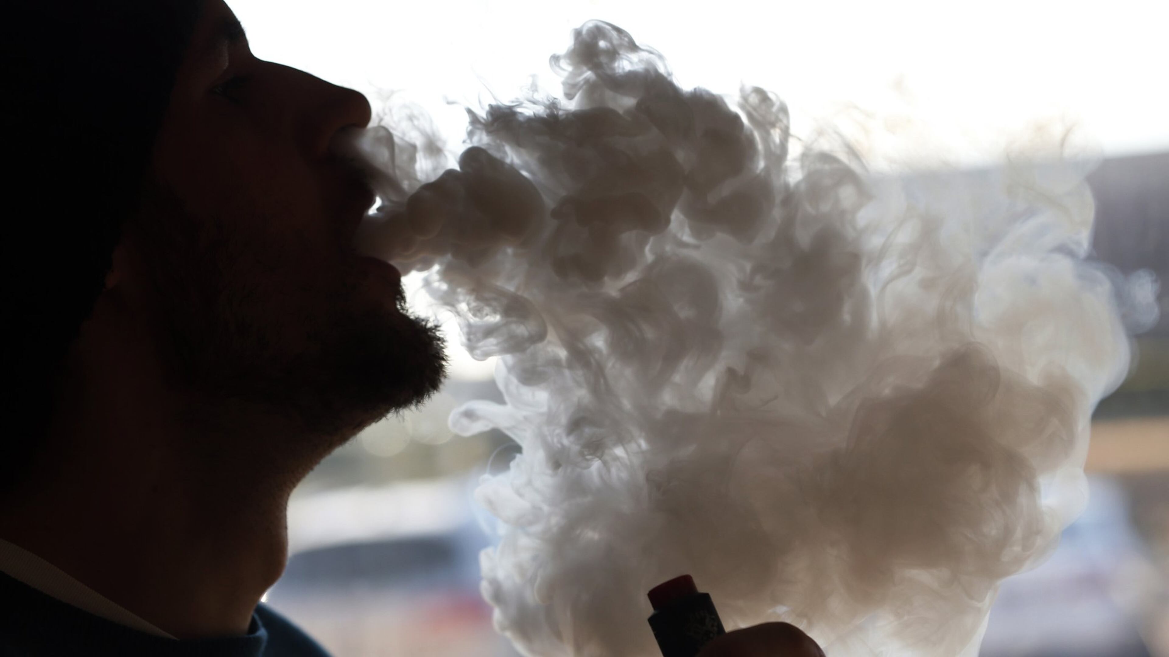 In this Friday, Jan. 18, 2019 file photo, a customer blows a cloud of smoke from a vape pipe at a local shop in Richmond, Va.