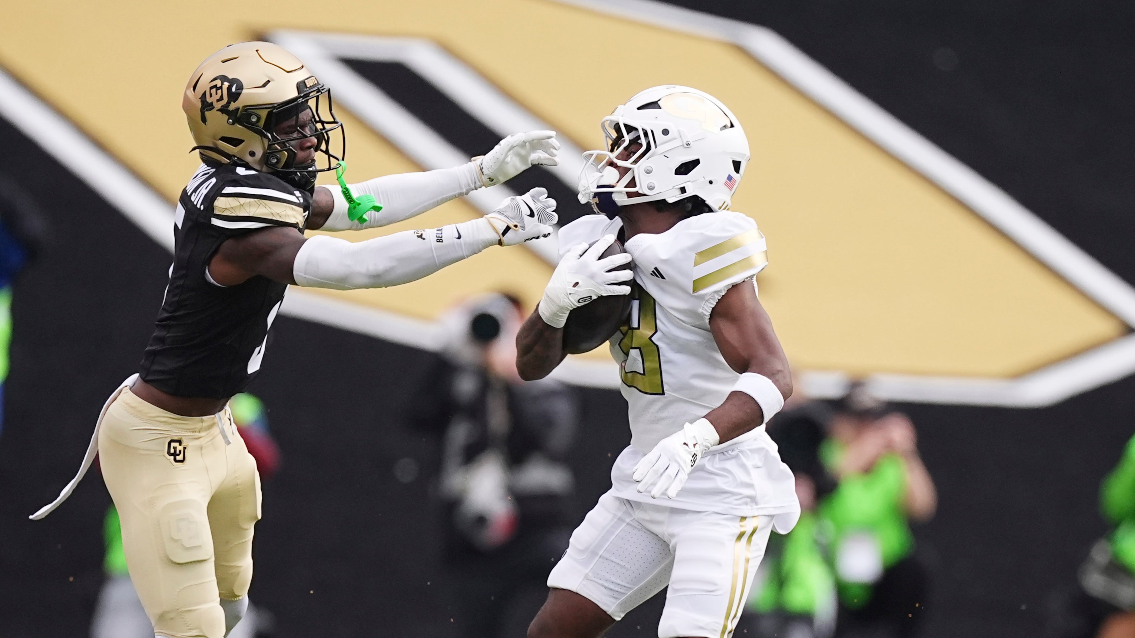 Colorado cornerback RJ Johnson, left, reaches out to stop Georgia Tech wide receiver Malik Rutherford in an NCAA college football game Friday, Aug. 29, 2025, in Boulder, Colo. (David Zalubowski/AP)