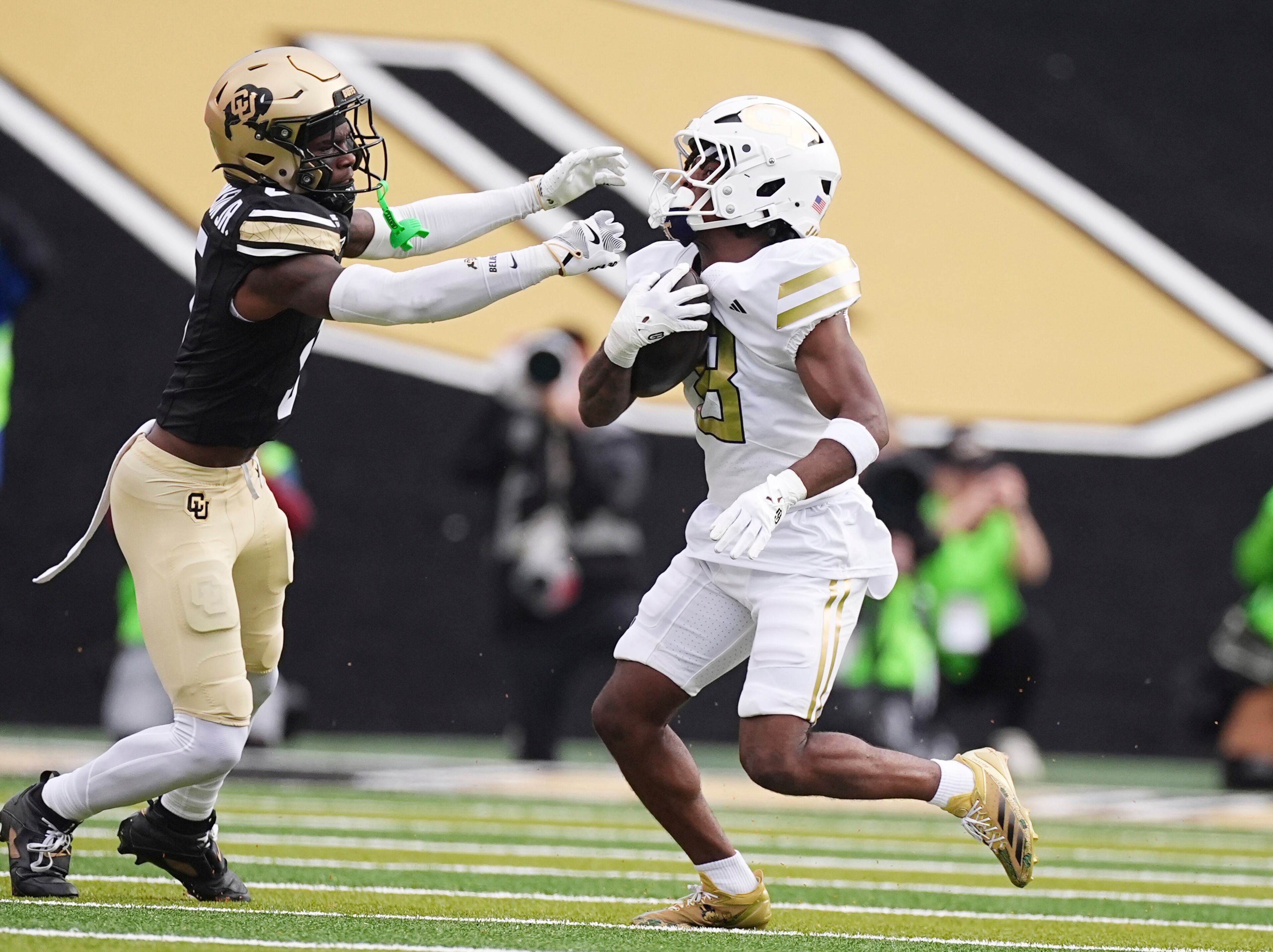 Colorado cornerback RJ Johnson (left) reaches out to stop Georgia Tech wide receiver Malik Rutherford on Friday, Aug. 29, 2025, in Boulder, Colo. (David Zalubowski/AP)