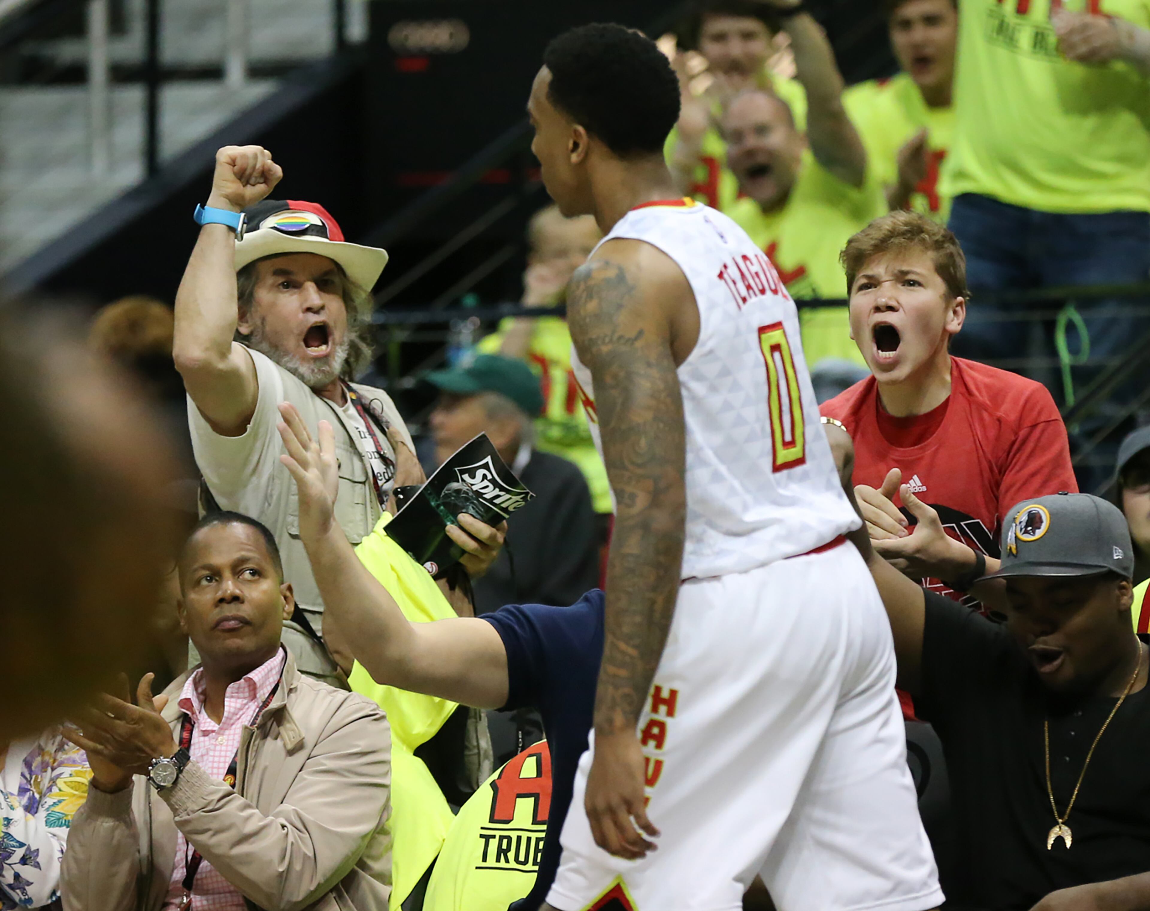 041616 ATLANTA: Hawks guard Jeff Teague fires up the fans after scoring against the Celtics in their first NBA Playoff basketball game at Philips Arena on Saturday, April 16, 2016. Curtis Compton / ccompton@ajc.com