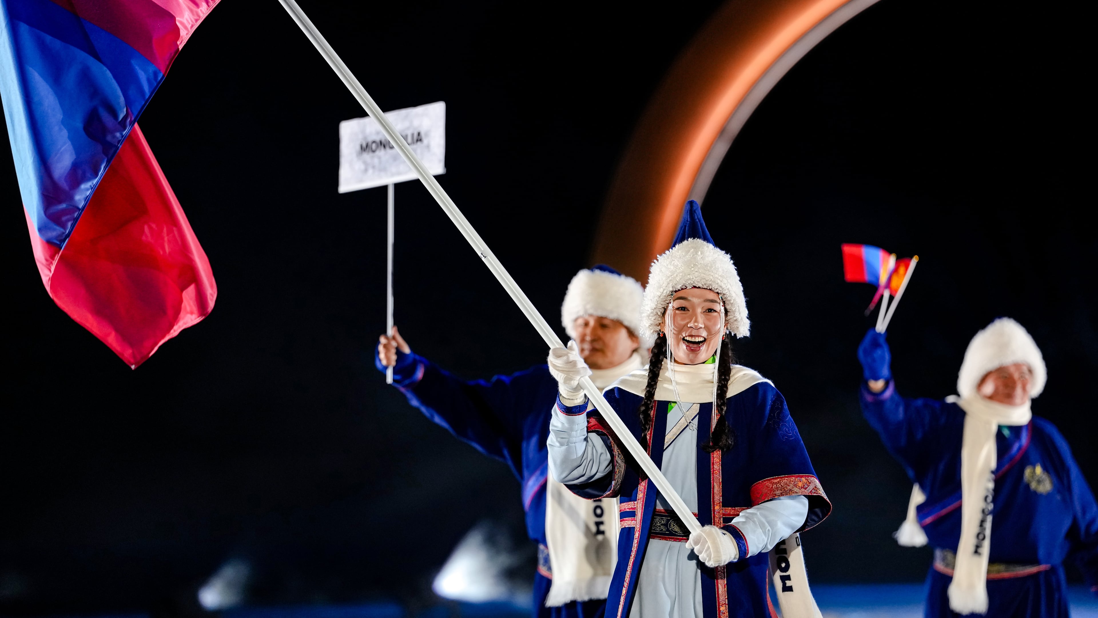 Ariuntungalag Enkhbayar, the flag bearer of Mongolia, takes part in the athletes parade during the Olympic opening ceremony at the 2026 Winter Olympics, in Predazzo, Italy, Friday, Feb. 6, 2026. (AP Photo/Matthias Schrader)