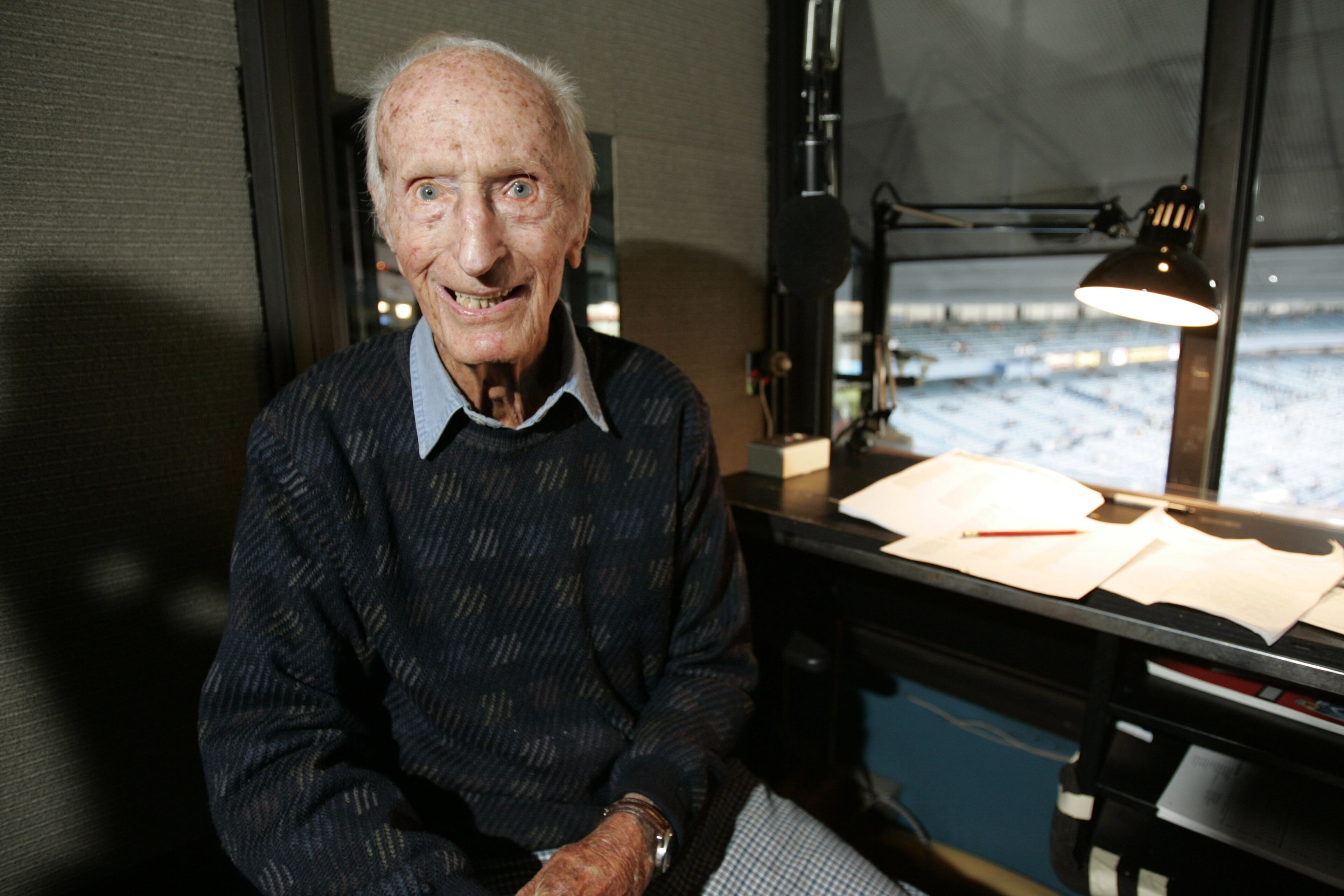 FILE - In this April 21, 2006, file photo, New York Yankees public address announcer Bob Sheppard pauses from his work for a photograph before a baseball game between the Baltimore Orioles and New York Yankees at Yankee Stadium in New York. When Derek Jeter plays his final game at Yankee Stadium, Bob Sheppard will exit along with the New York Yankees captain. Nicknamed "The Voice of God" for his stylish, elegant introductions, Sheppard was the ballpark's public address announcer from April 1951 until Sept. 7, 2007. Before Sheppard took ill, Jeter asked Sheppard to record his introduction, which has been used when the Yankees captain walked to the plate for home games. (AP Photo/Julie Jacobson, File)