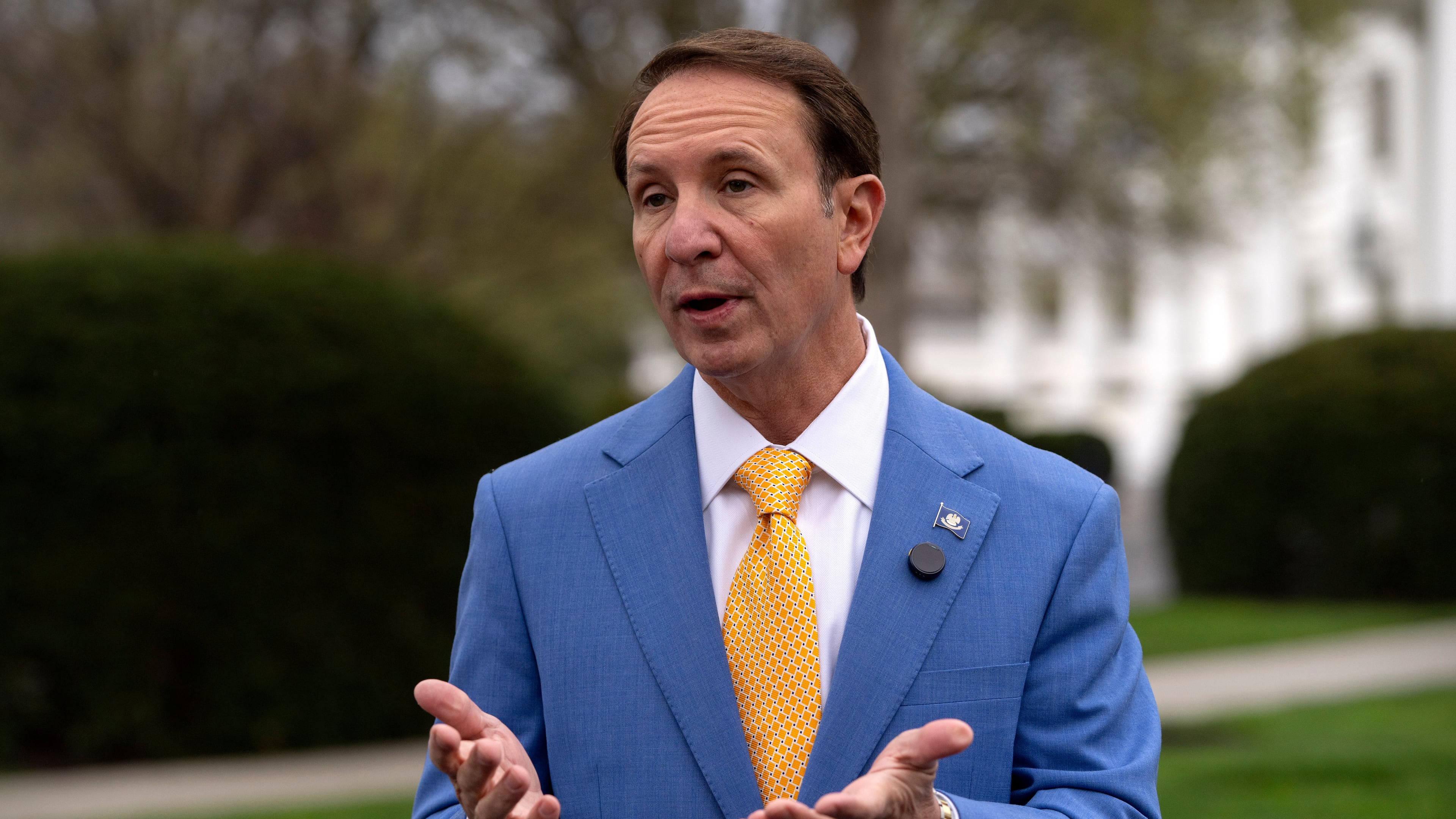 FILE - Louisiana Gov. Jeff Landry records a social media video outside the White House, Monday, March 24, 2025, in Washington. (AP Photo/Mark Schiefelbein, File)