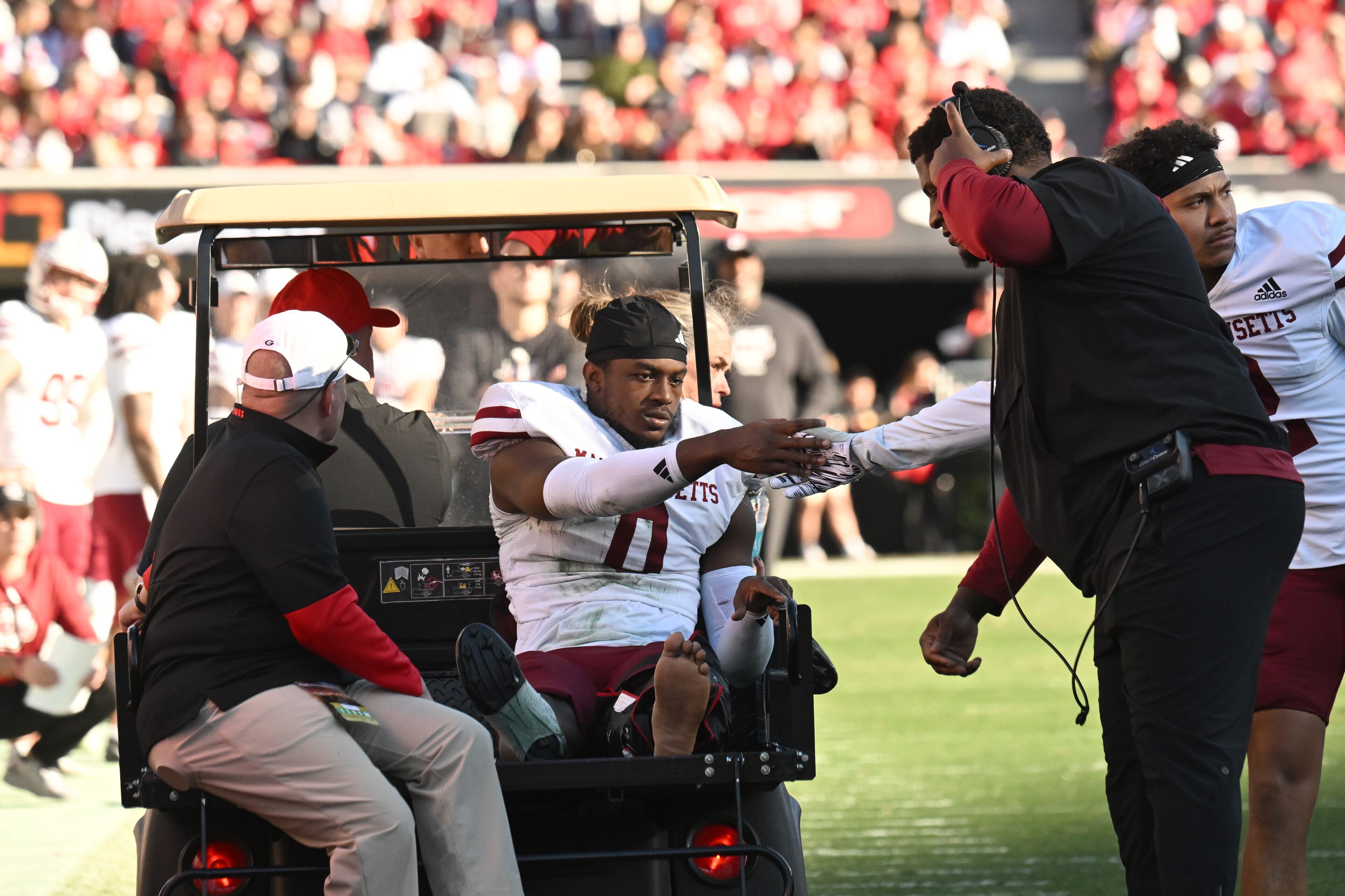 UMass linebacker Jalen Harrell (0) is carted off the field after getting injured during the second half in an NCAA football game at Sanford Stadium, Saturday, November 23, 2024, in Athens. Georgia won 59-21 over UMass. (Hyosub Shin / AJC)