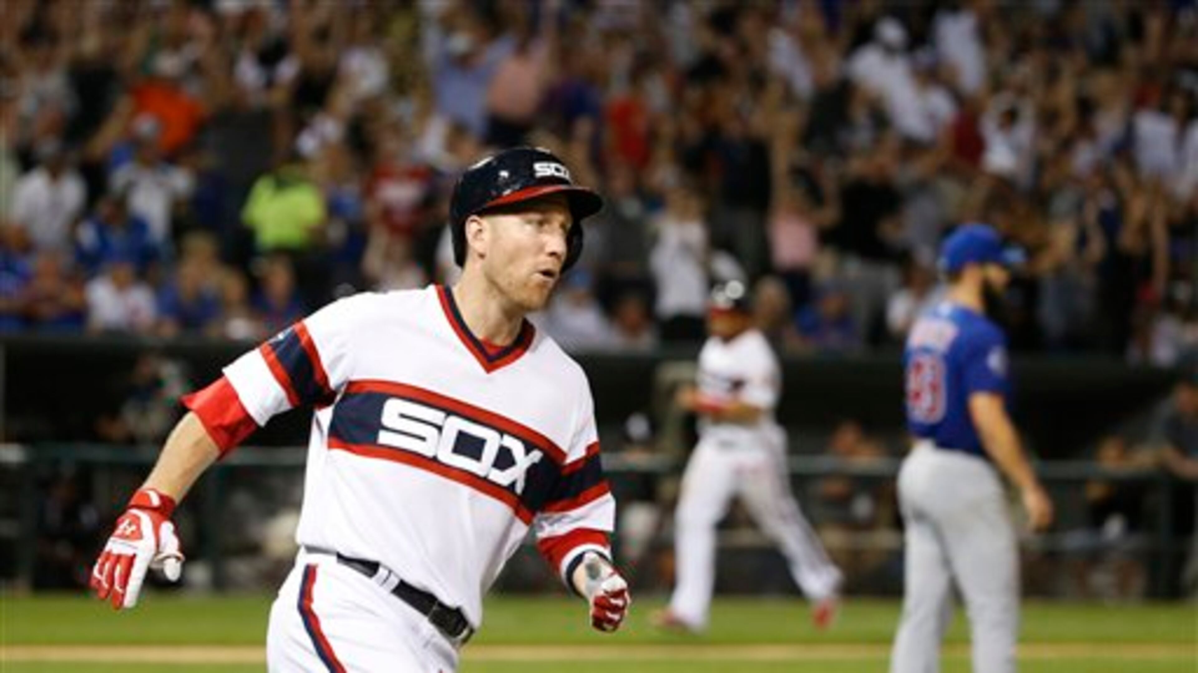 Chicago White Sox's Todd Frazier, left, rounds the bases after hitting a three-run home run off Chicago Cubs starting pitcher Jake Arrieta, right, also scoring Melky Cabrera and Jose Abreu during the sixth inning of a baseball game Monday, July 25, 2016, in Chicago. (AP Photo/Charles Rex Arbogast)