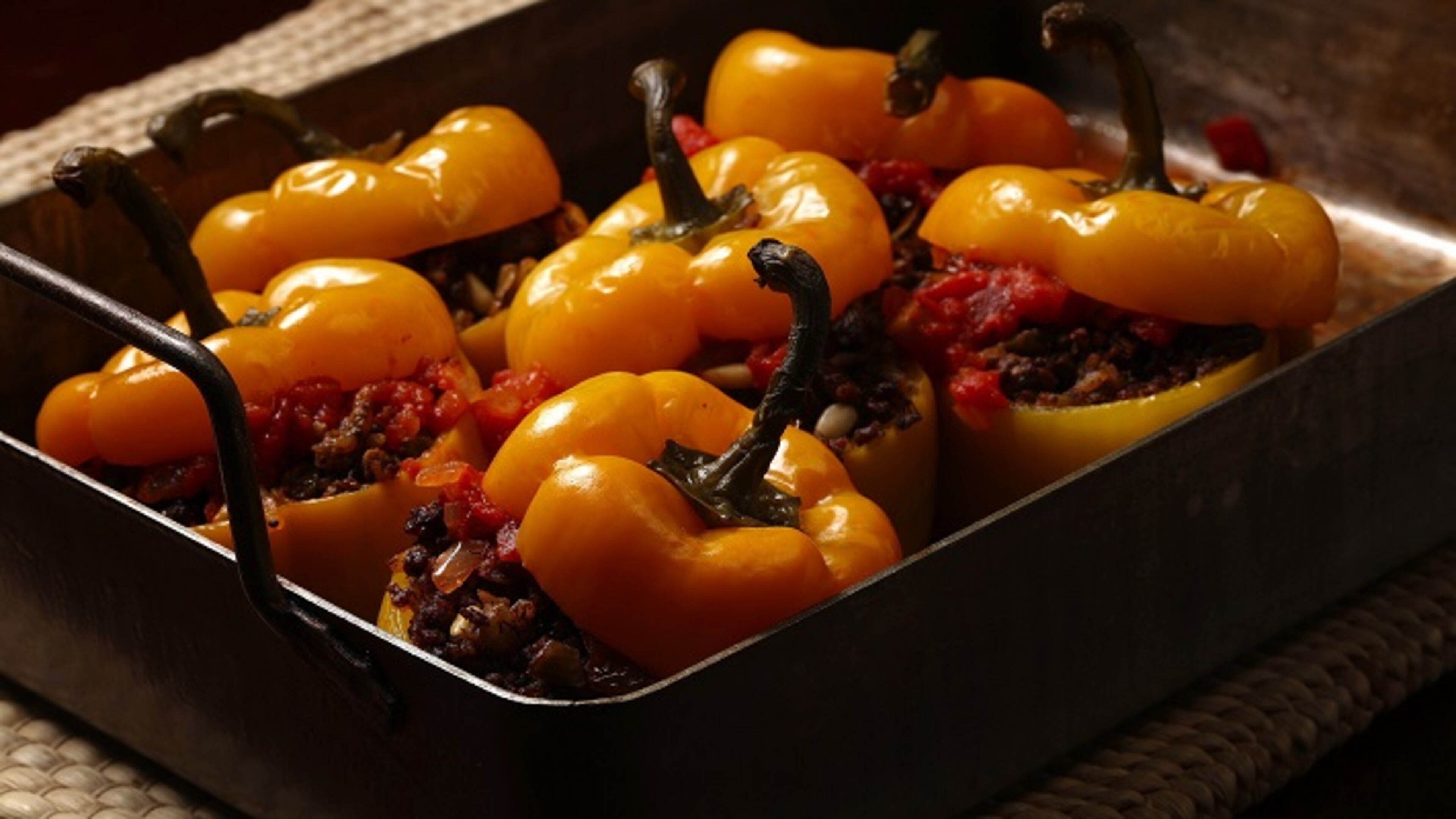 Serbian style stuffed red bell peppers are filled with ground beef, onion, peppers, garlic, pine nuts, rice and raisins.
(E. Jason Wambsgans/Chicago Tribune/TNS)