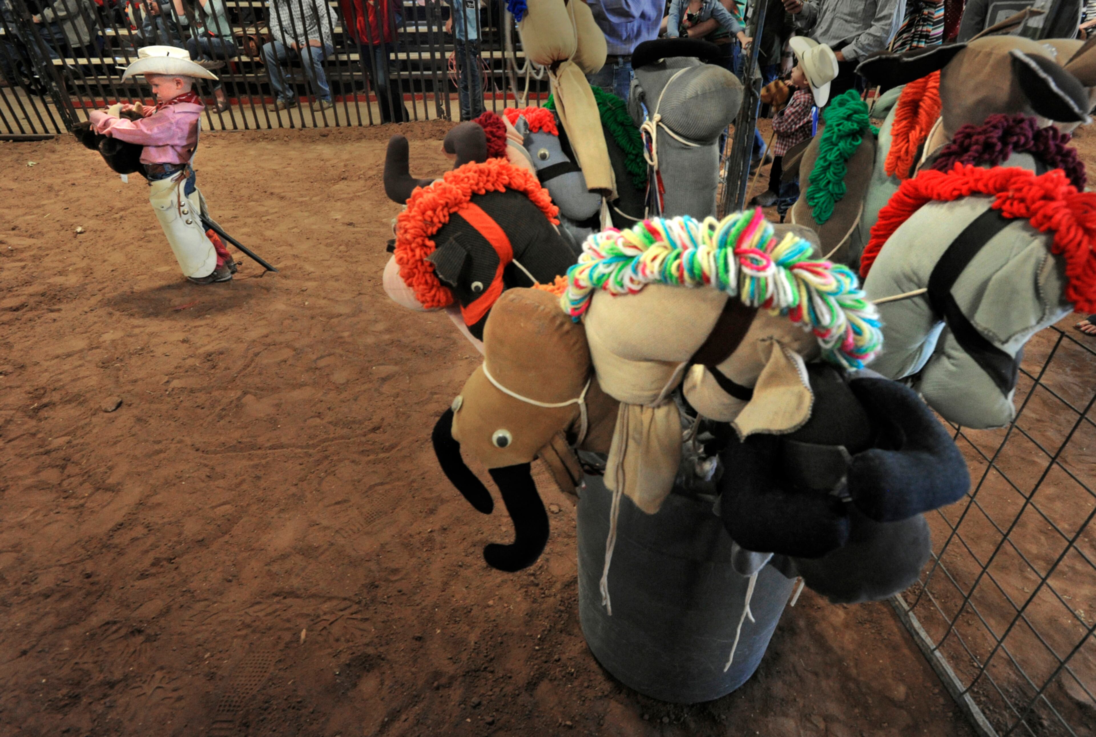 Tripp Klam, 4, of Cranfills Gap, Texas, waits for the bronc riding to start in the Western Heritage Classic's Stickhorse Rodeo on Saturday, May 13, 2017, in Abilene, Texas. Different age groups competed in stickhorse versions of traditional rodeo events such as bronc riding, steer dummy roping and barrel racing. (Ronald W. Erdrich/The Abilene Reporter-News via AP)
