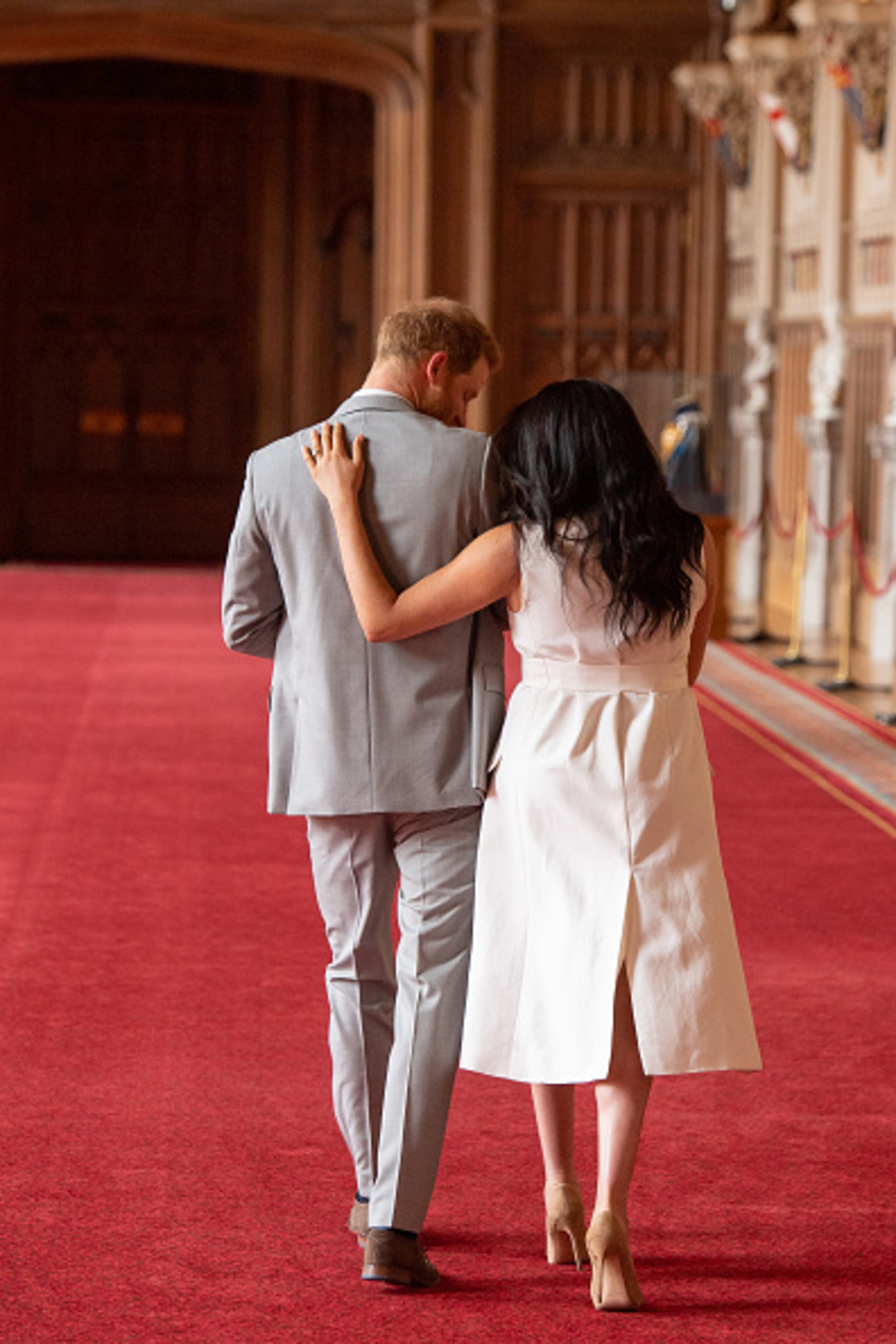 Prince Harry, Duke of Sussex and Meghan, Duchess of Sussex, pose with their newborn son during a photocall in St George's Hall at Windsor Castle on May 8, 2019 in Windsor, England. The Duchess of Sussex gave birth at 05:26 on Monday 06 May, 2019.